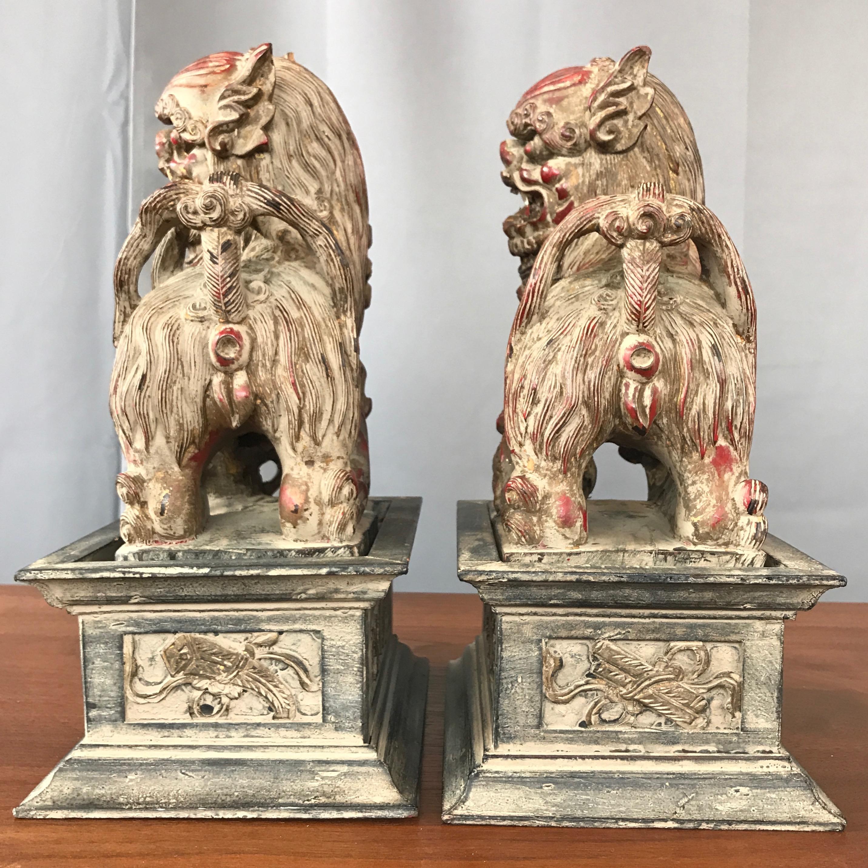 Chinese Lacquered and Giltwood Guardian Lions on Pedestals, a Pair 1