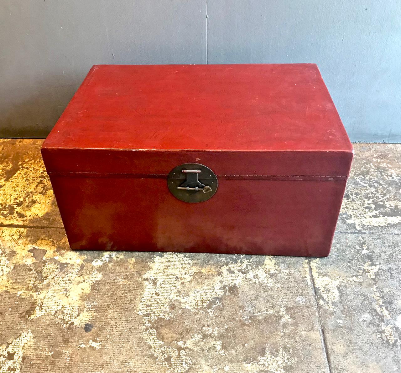 This is a Classic Chinese lacquered pigskin trunk that dates to the early 20th century. The cinnabar red lacquer is in very good condition considering its age and use. The interior is also in good condition. Normal patination for age and use.