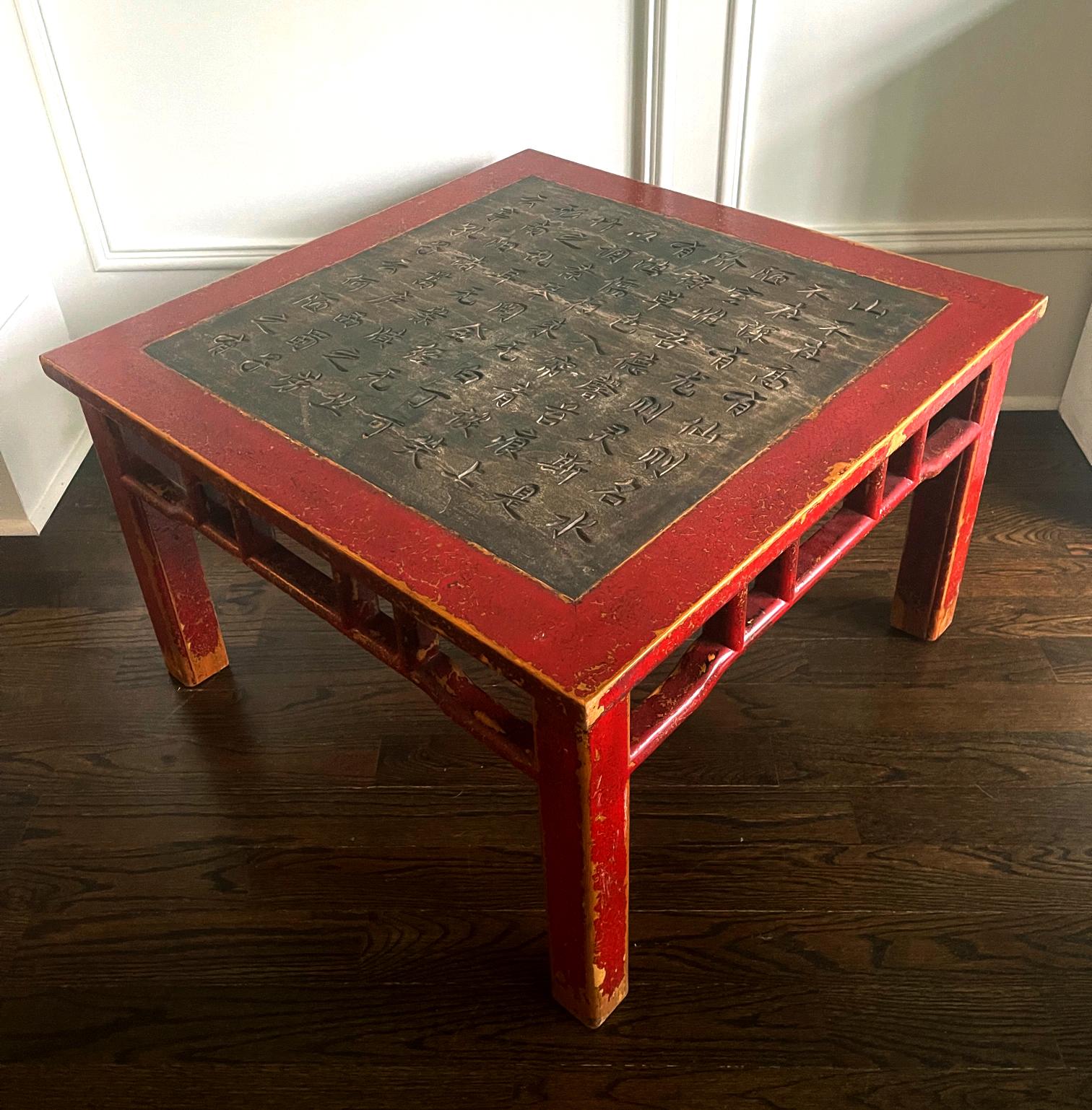 A Chinese antique table from Northern China likely Shanxi Province circa late Qing dynasty to Republic period (late 19th century). The square form table was constructed with Elm wood and coated with a red lacquer that still largely remains, but