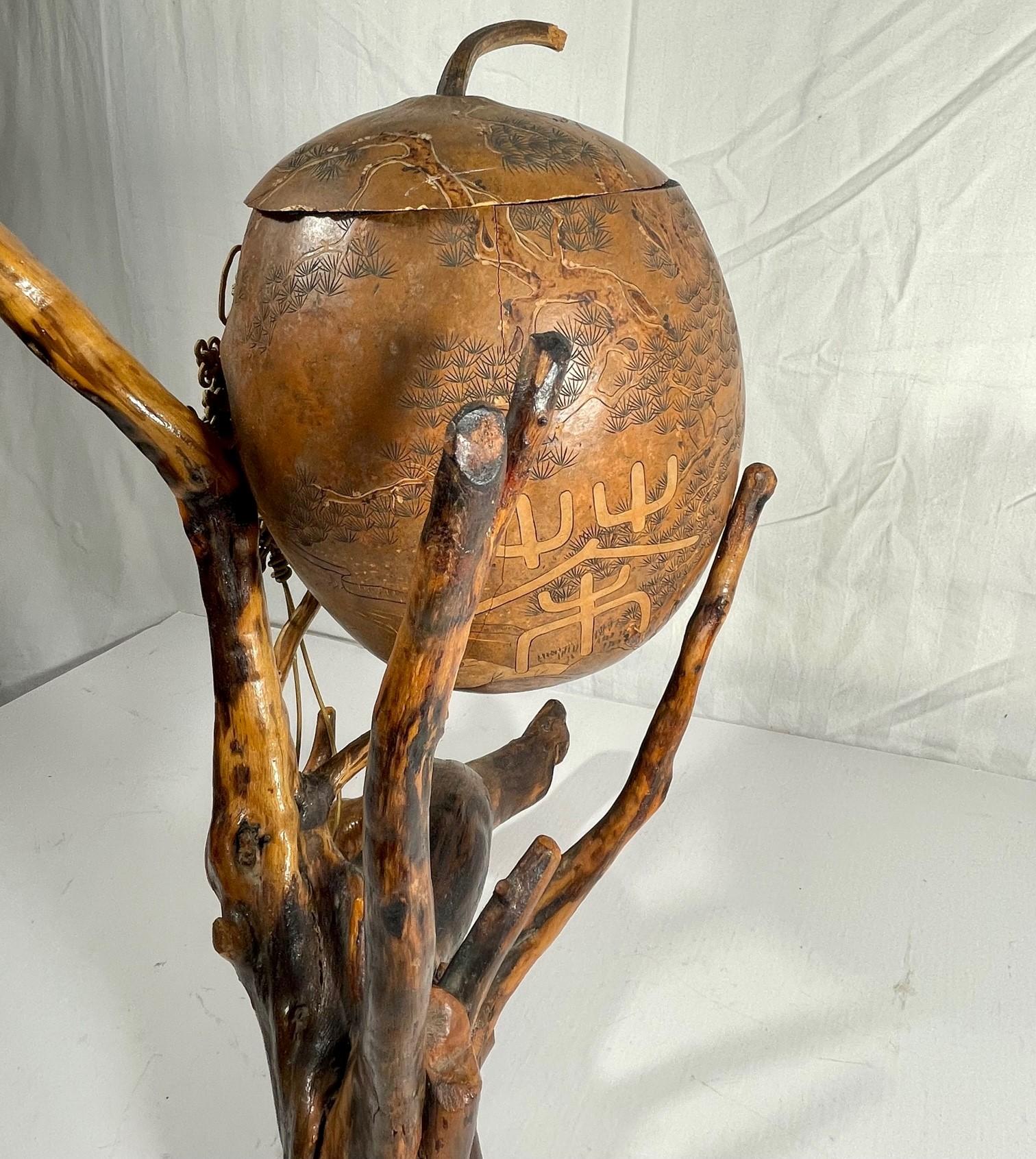 20th Century Chinese Lanzhou Gourd Carving with Macrame Cord on Root Stand Sculpture For Sale