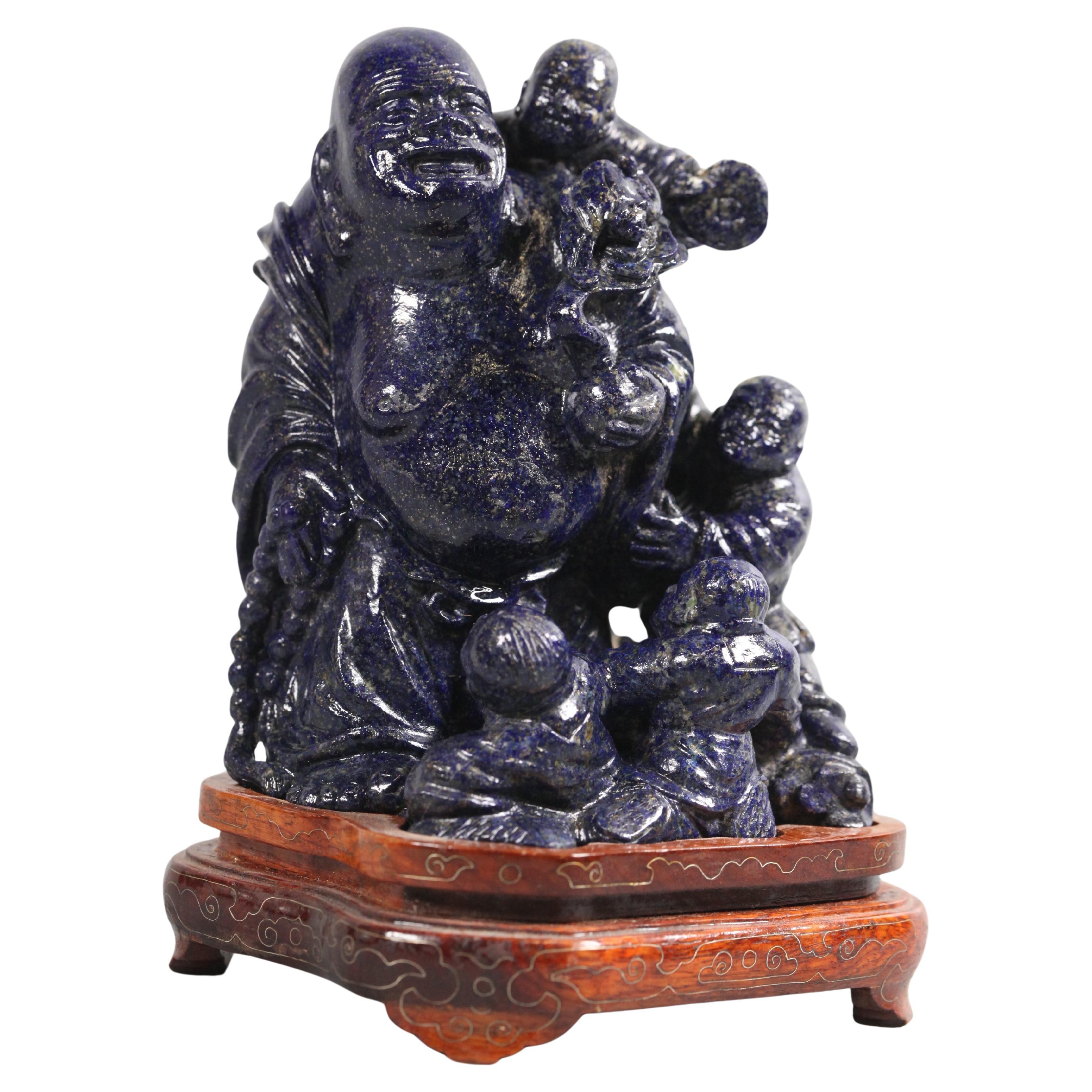 Sculpture chinoise en lapis représentant le Bouddha Hotei avec des enfants