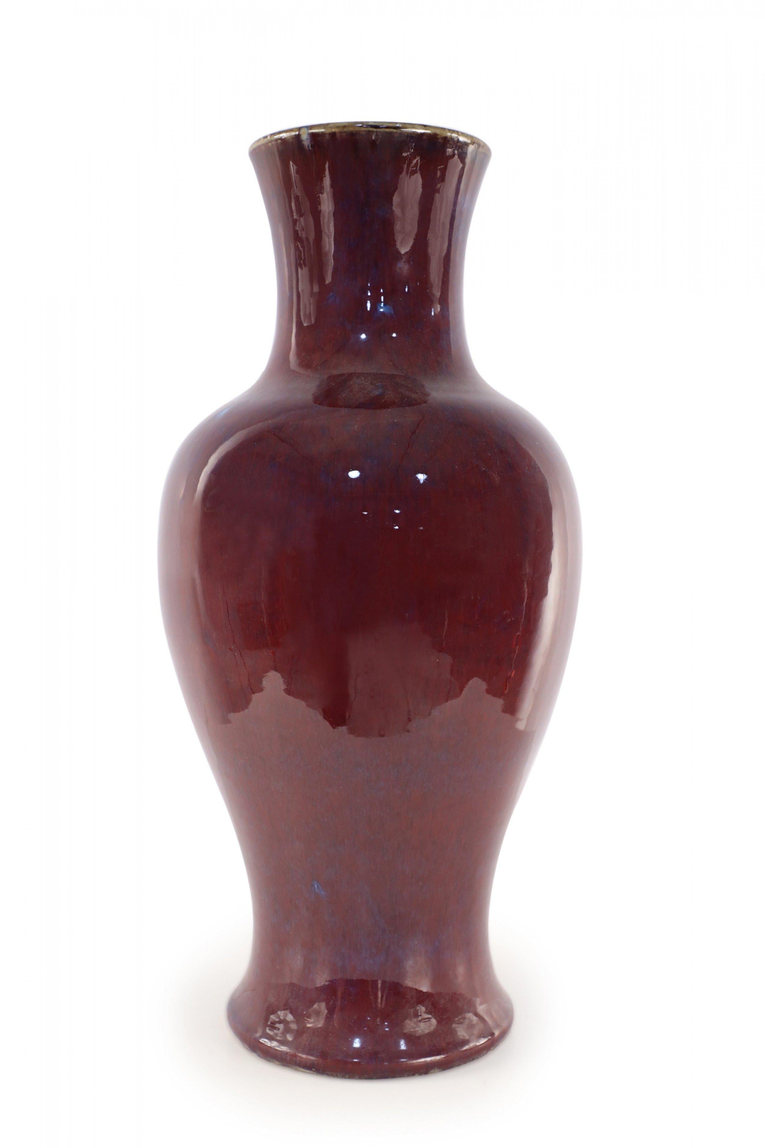 Chinese porcelain urn-form vase in a rich aubergine color overlayed with a barely visible blue base, creating highs and lows that add dimension to the finish and form.