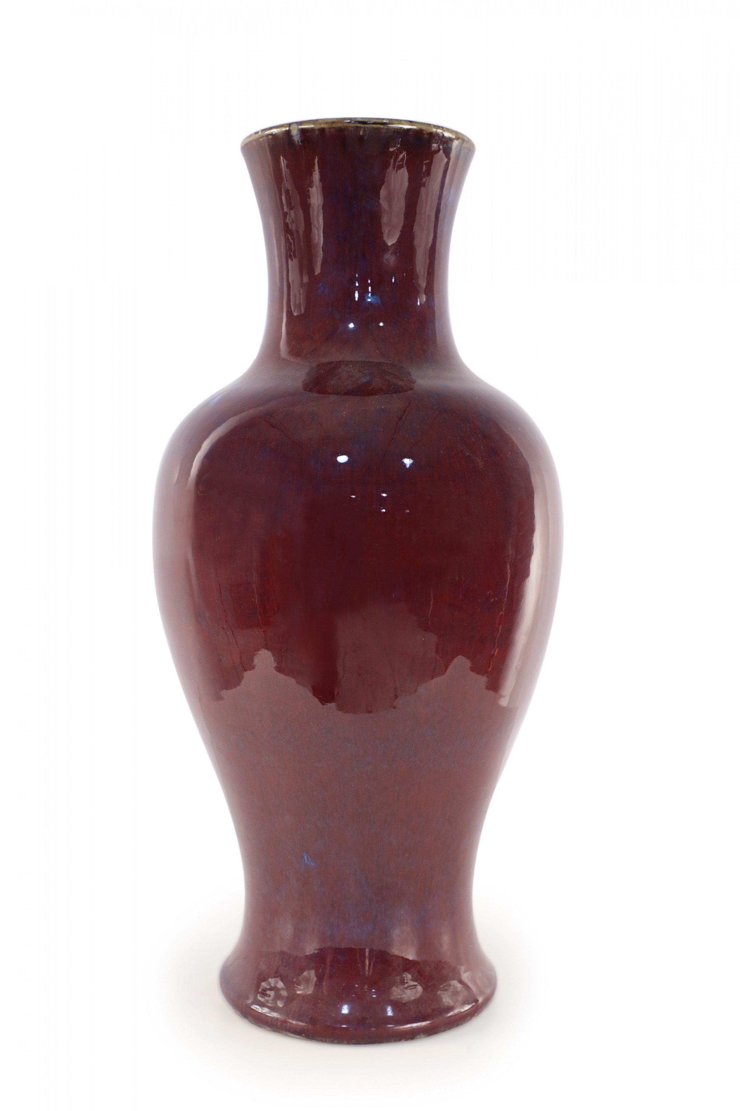 Chinese porcelain urn-form vase in a rich aubergine color overlayed with a barely visible blue base, creating highs and lows that add dimension to the finish and form.

Slight imperfections in urn.