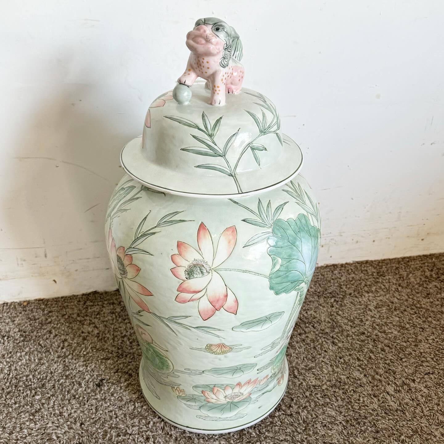The Chinese Large Ginger Jar/Vase with Foo Dog Lid is a remarkable display of Chinese artistry. Featuring a sculpted foo dog on the lid, it symbolizes protection and adds asian charm. Its large size makes it a statement piece, perfect for any room.