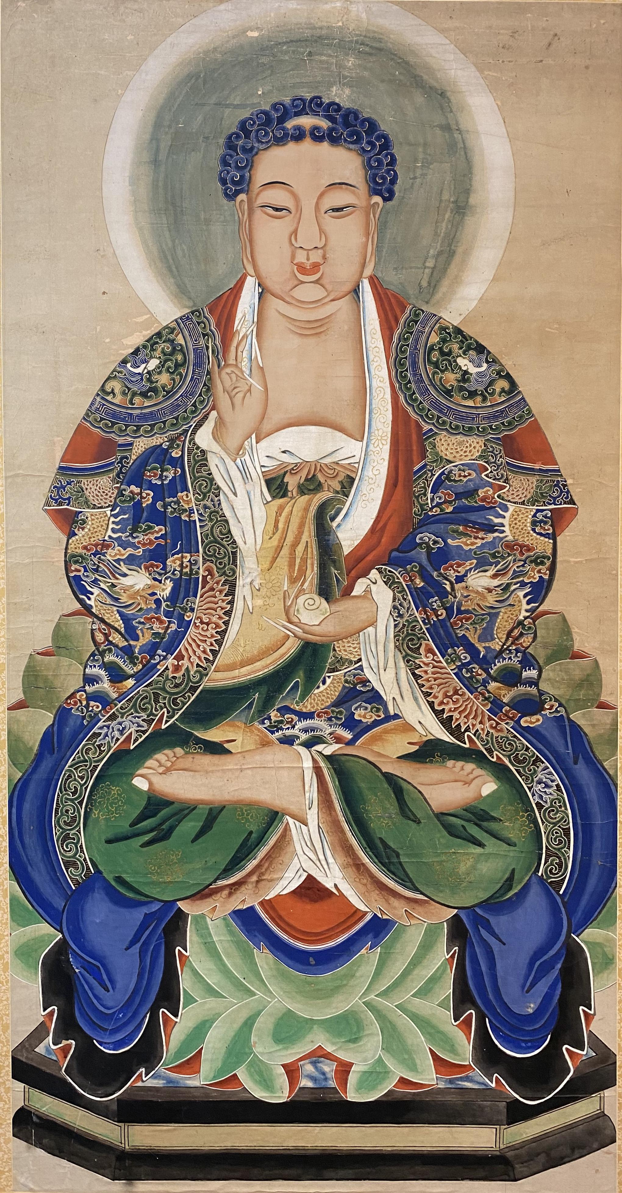A fine vintage Chinese large pigment on paper portrait of Buddha mounted on panel with foliate silk border, housed in an ebonized and giltwood frame. Dates to the 20th century in very good overall condition, with some minor paper losses, rubs,