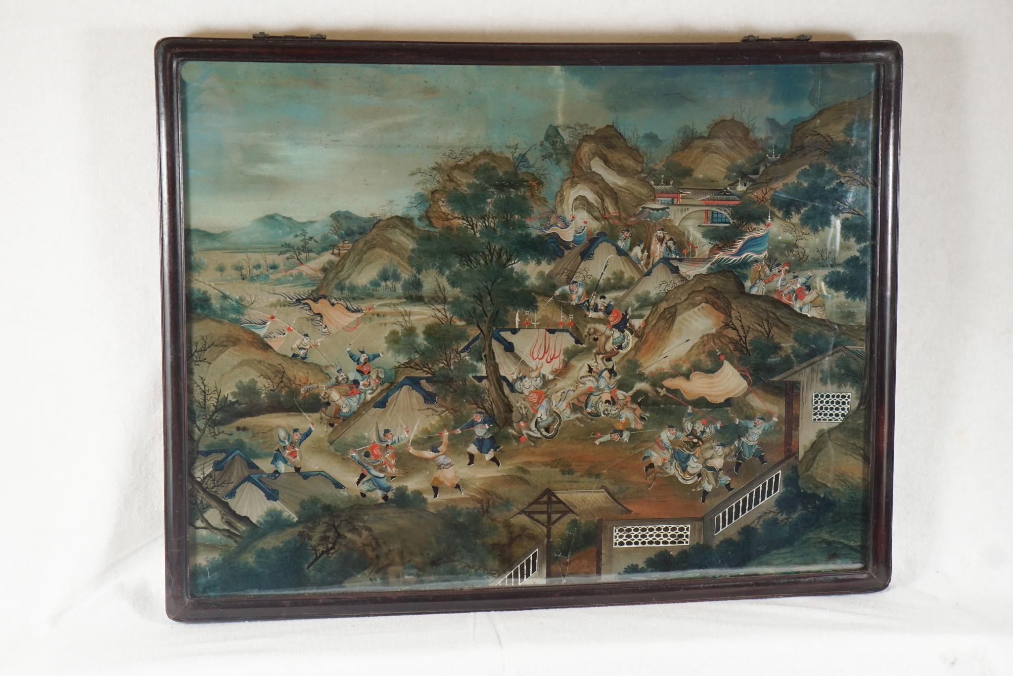 This large reverse painting on glass from China circa 1780 to 1790 depicts a dramatic battle scene of numerous horsemen and infantry charging in a very hilly estate's grounds among buildings trees and a garden-like park. All participants and horses