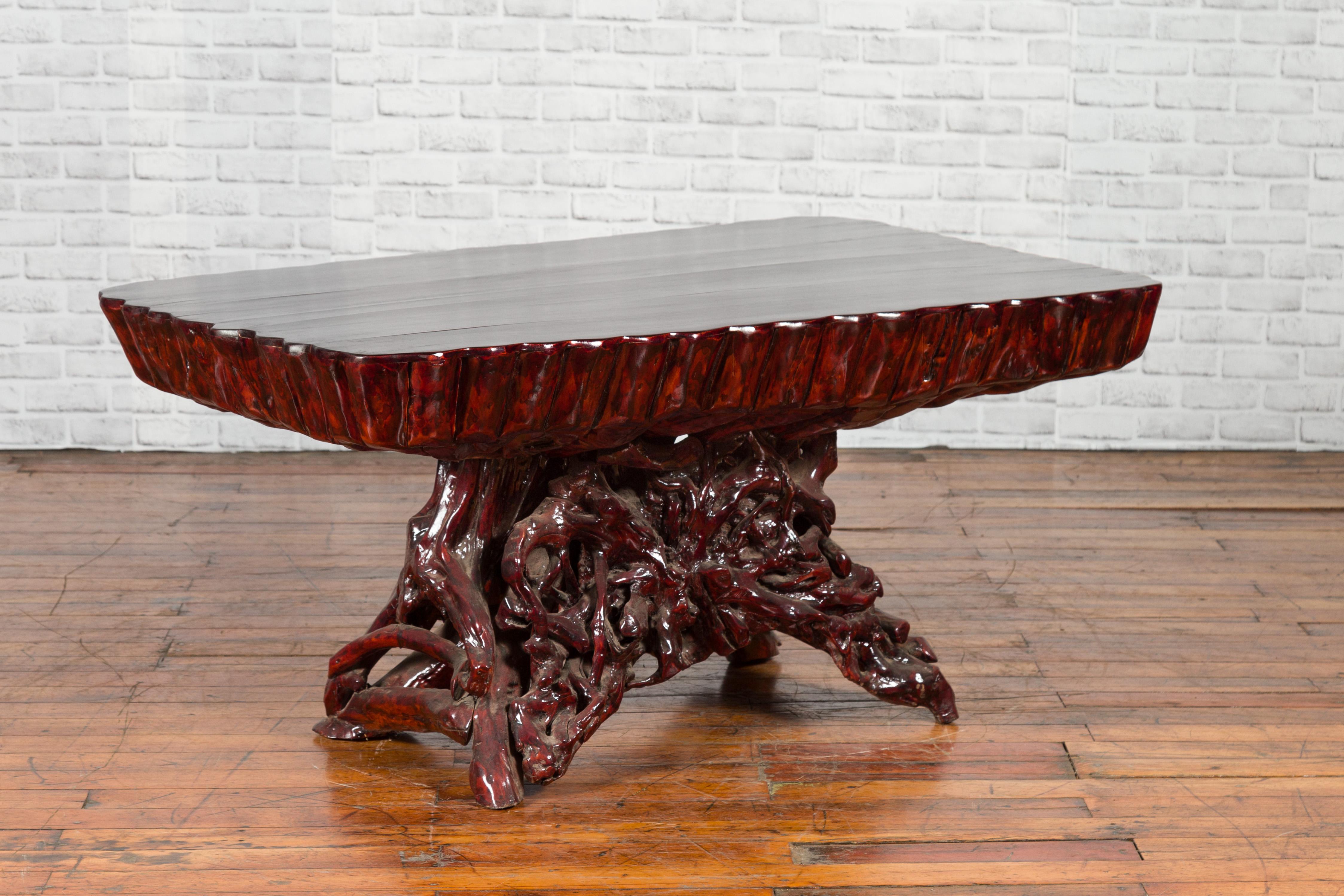 A Chinese coffee table from the late 20th century, hand carved out of one complete azalea root. Created in China during the later years of the 20th century, this striking coffee table was hand carved from a single azalea root and lacquered to its