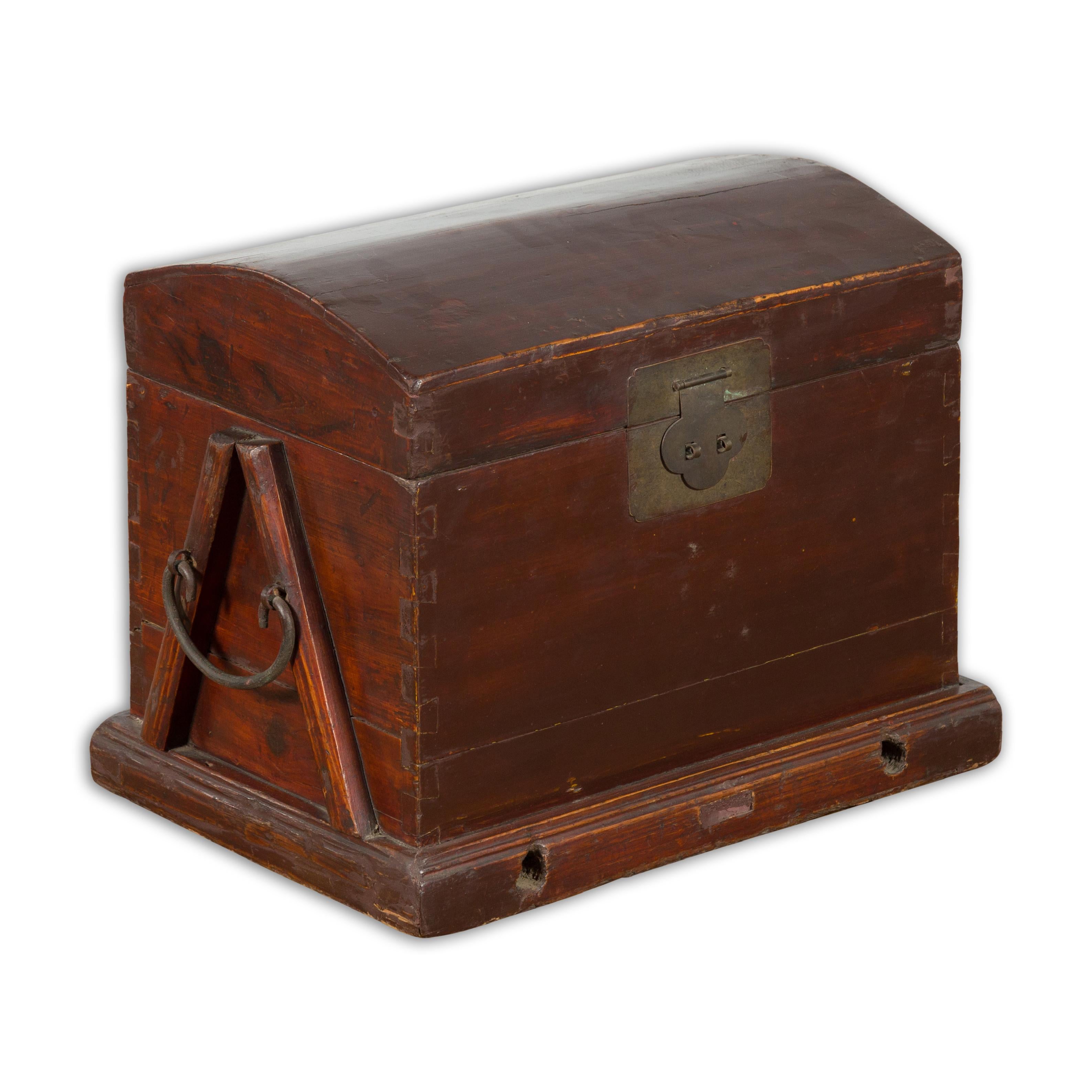 An antique Chinese Late Qing Dynasty period wooden document box from the early 20th century with reddish brown lacquer, brass hardware and carrying handles. Created in China during the late Qing Dynasty period in the early years of the 20th century,