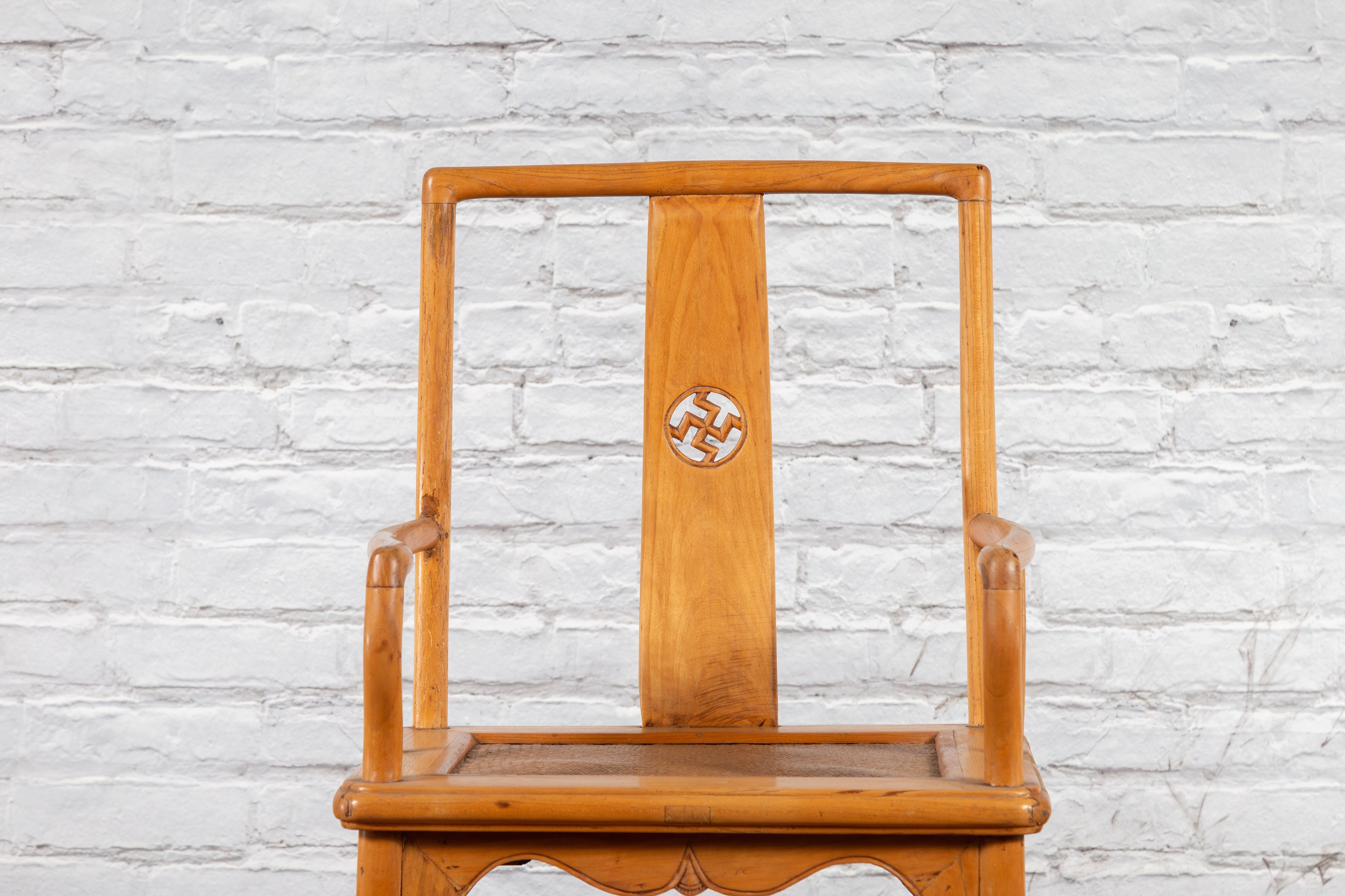 Chinese Late Qing Dynasty Elmwood Armchair with Hand-Carved Medallion For Sale