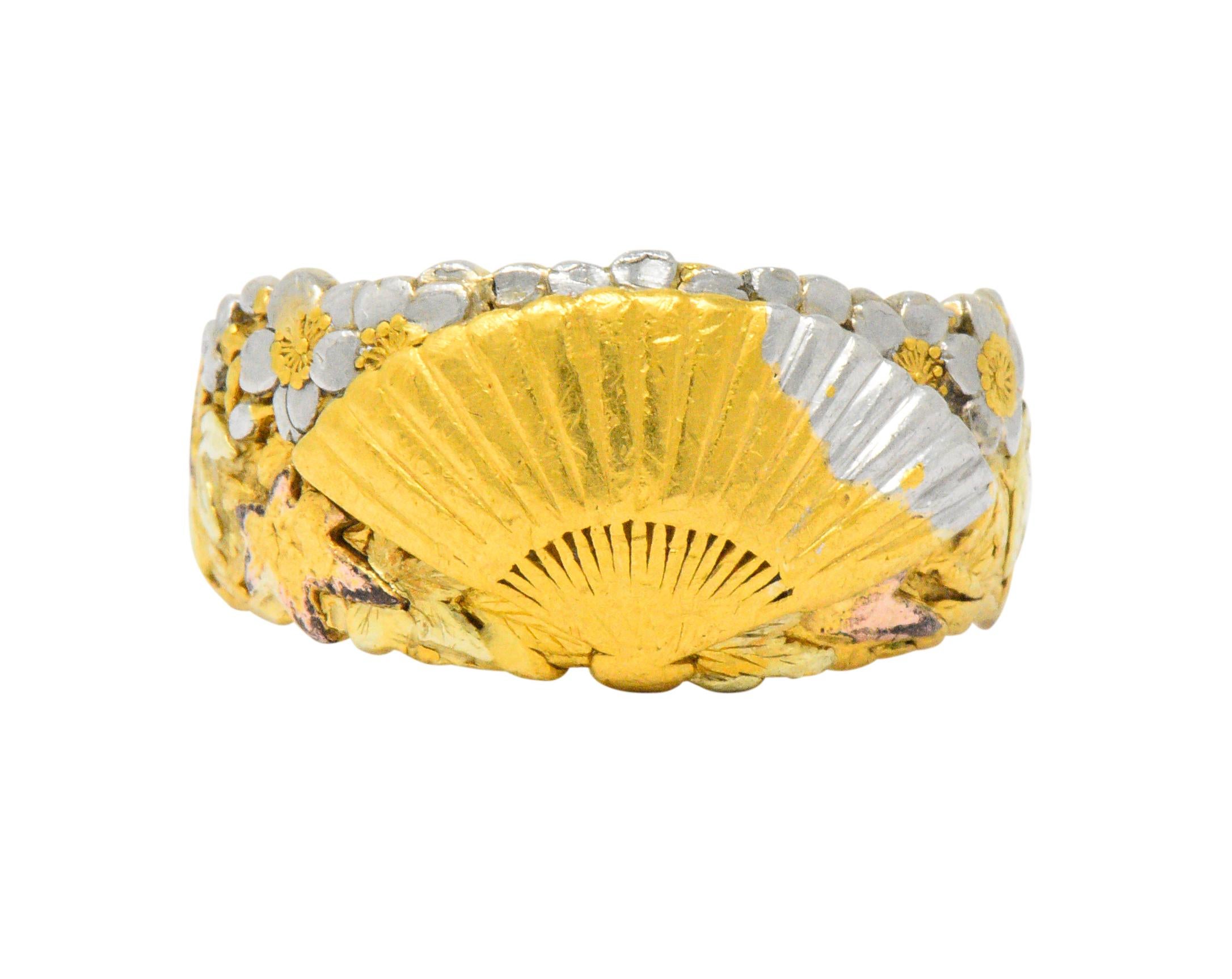Centering a raised fan

With floral and foliate motifs accented in yellow, green, rose gold and platinum

Chinese signature

Tested as 22 karat gold

Ring Size: 8 1/2 & Sizable

Top measures 11.1 mm and sits 2.7 mm high

Total Weight: 14.3