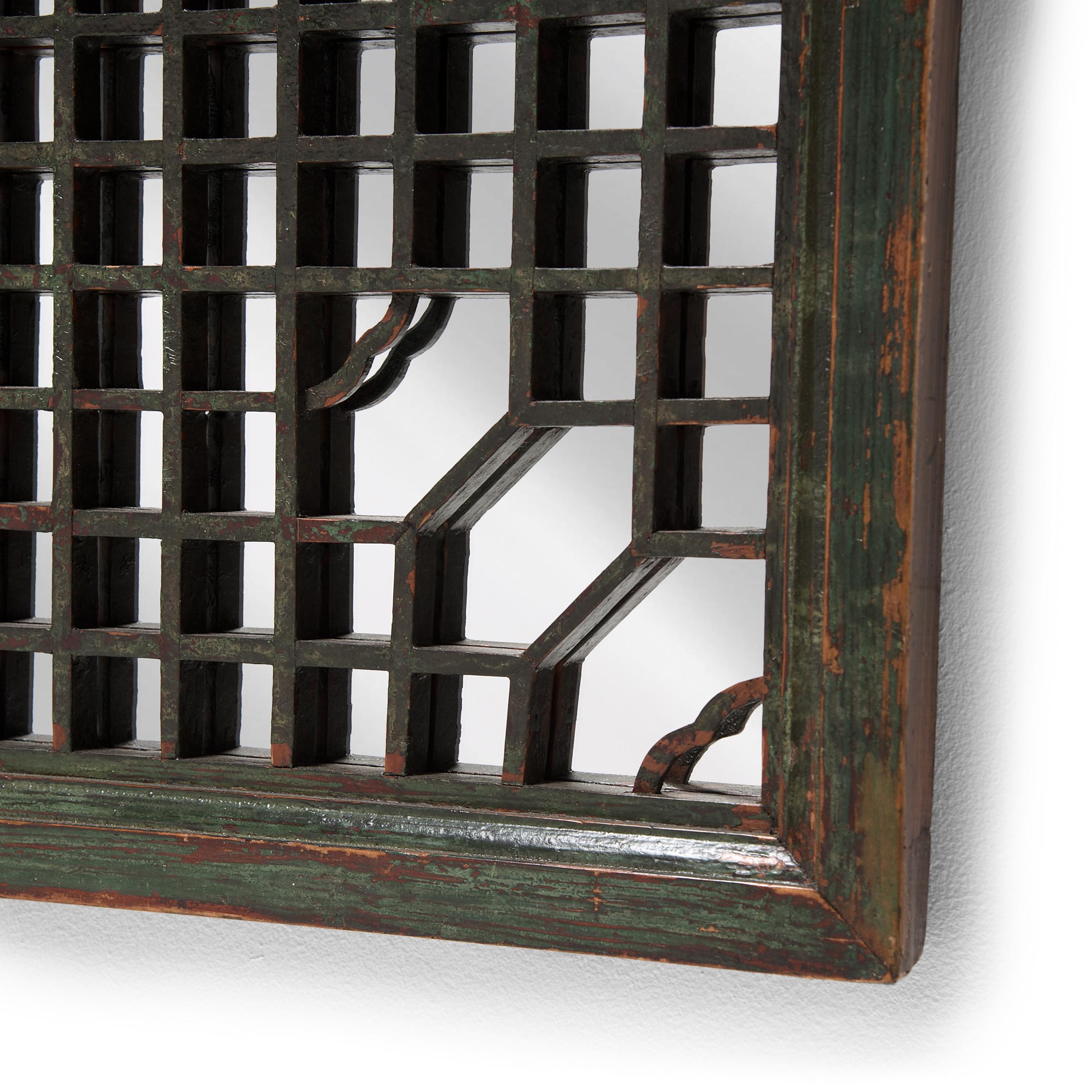 This lattice window panel likely originated in an aristocratic Chinese home with neutral and balanced interiors. The geometric lattice pattern is linear and open, and was designed originally to allow light and air into a room while maintaining