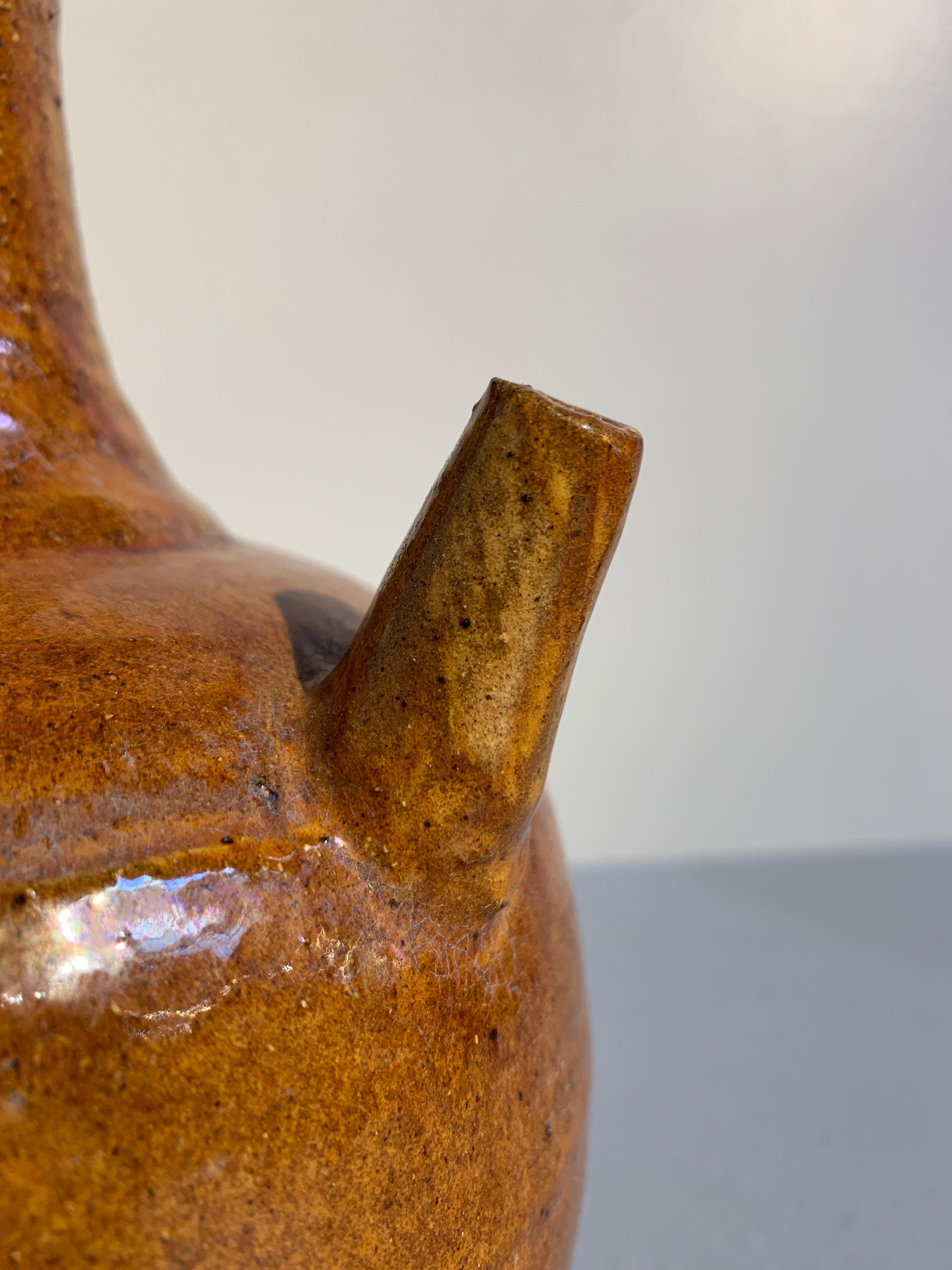 Tang Chinese Liao Dynasty Amber Glazed Stoneware Strap Handle Ewer, 11th Century For Sale