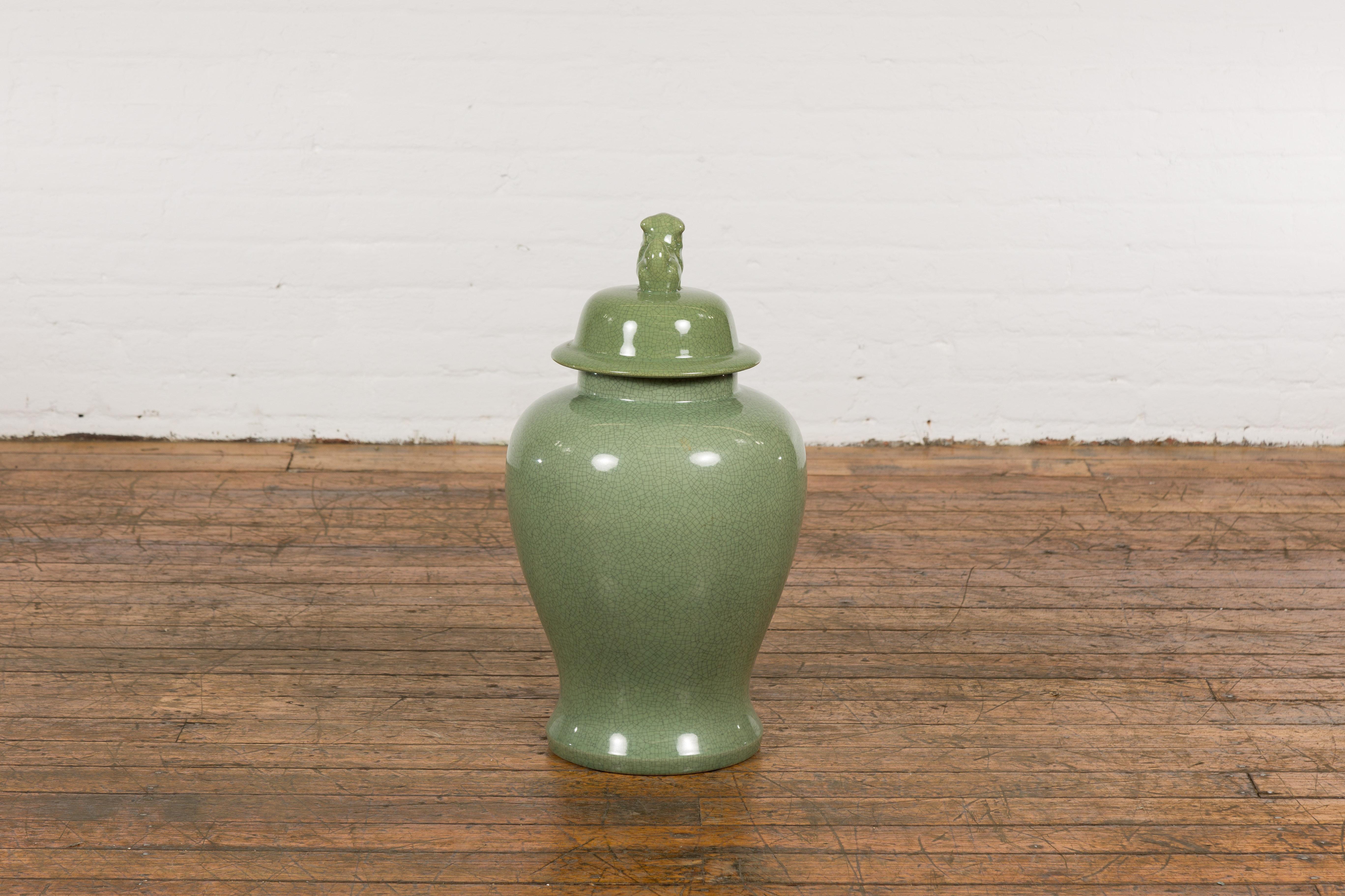 Chinese Lidded Altar Vase with Green Celadon Glaze and Guardian Lion Motif For Sale 8