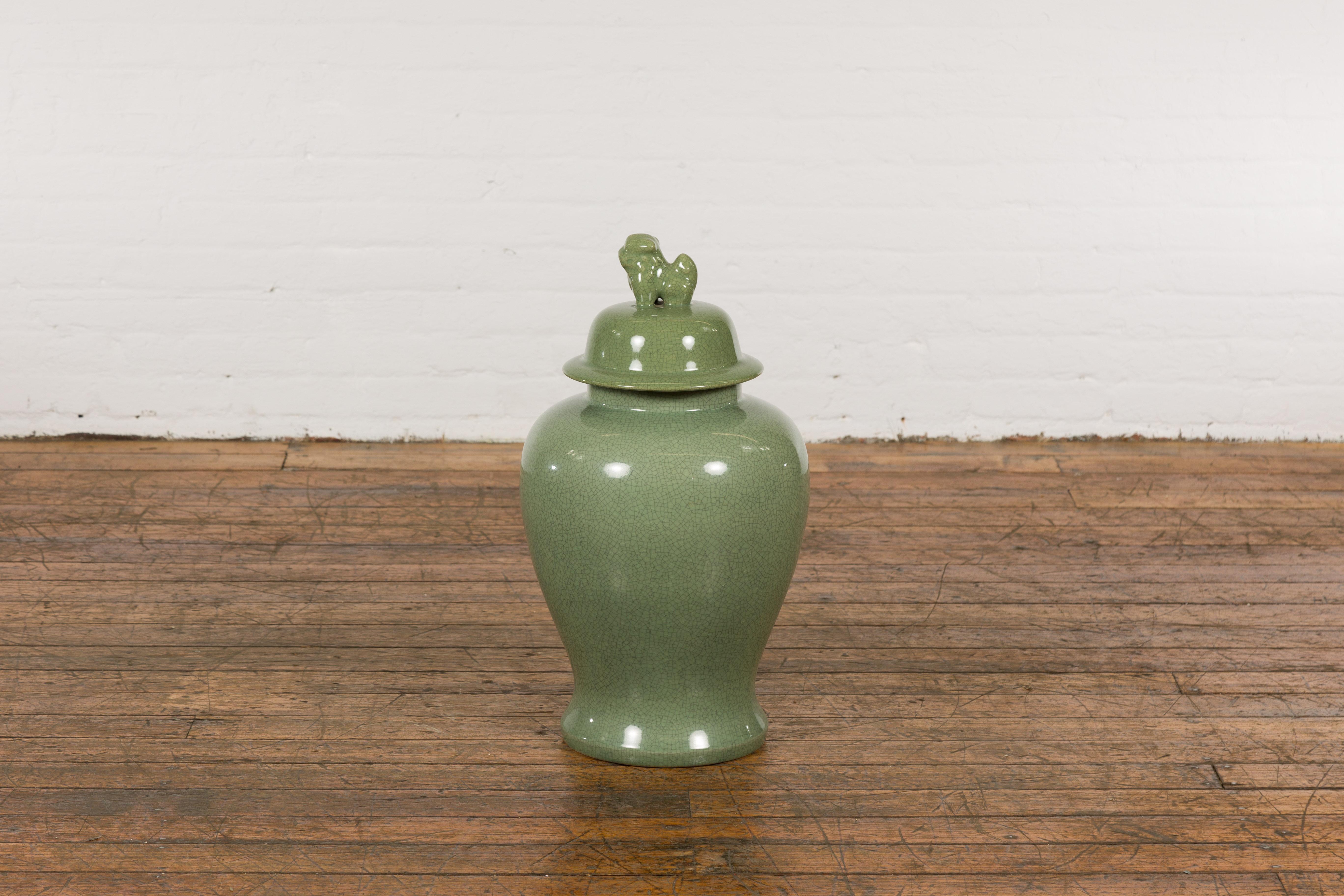 Glazed Chinese Lidded Altar Vase with Green Celadon Glaze and Guardian Lion Motif For Sale