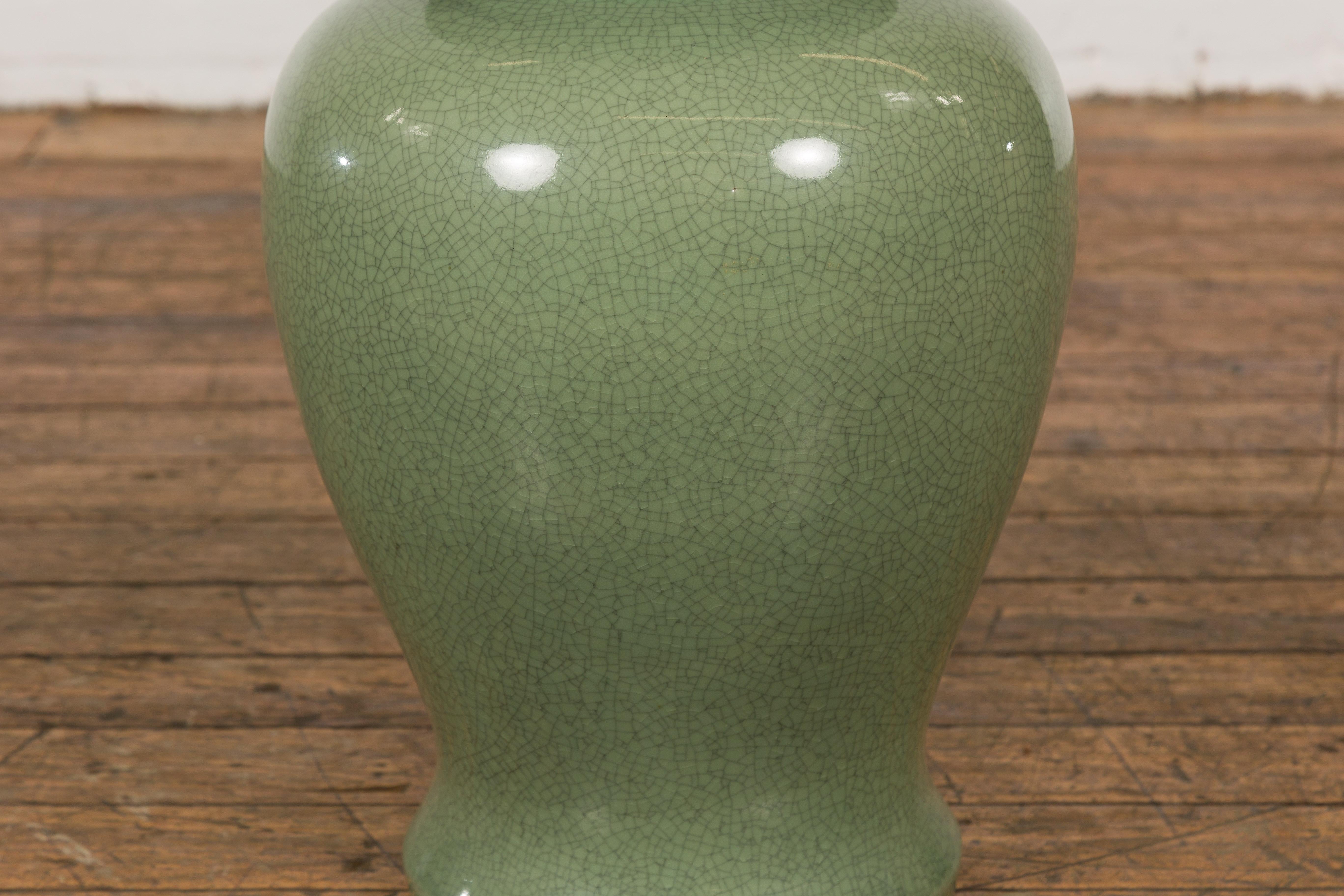 Chinese Lidded Altar Vase with Green Celadon Glaze and Guardian Lion Motif For Sale 1