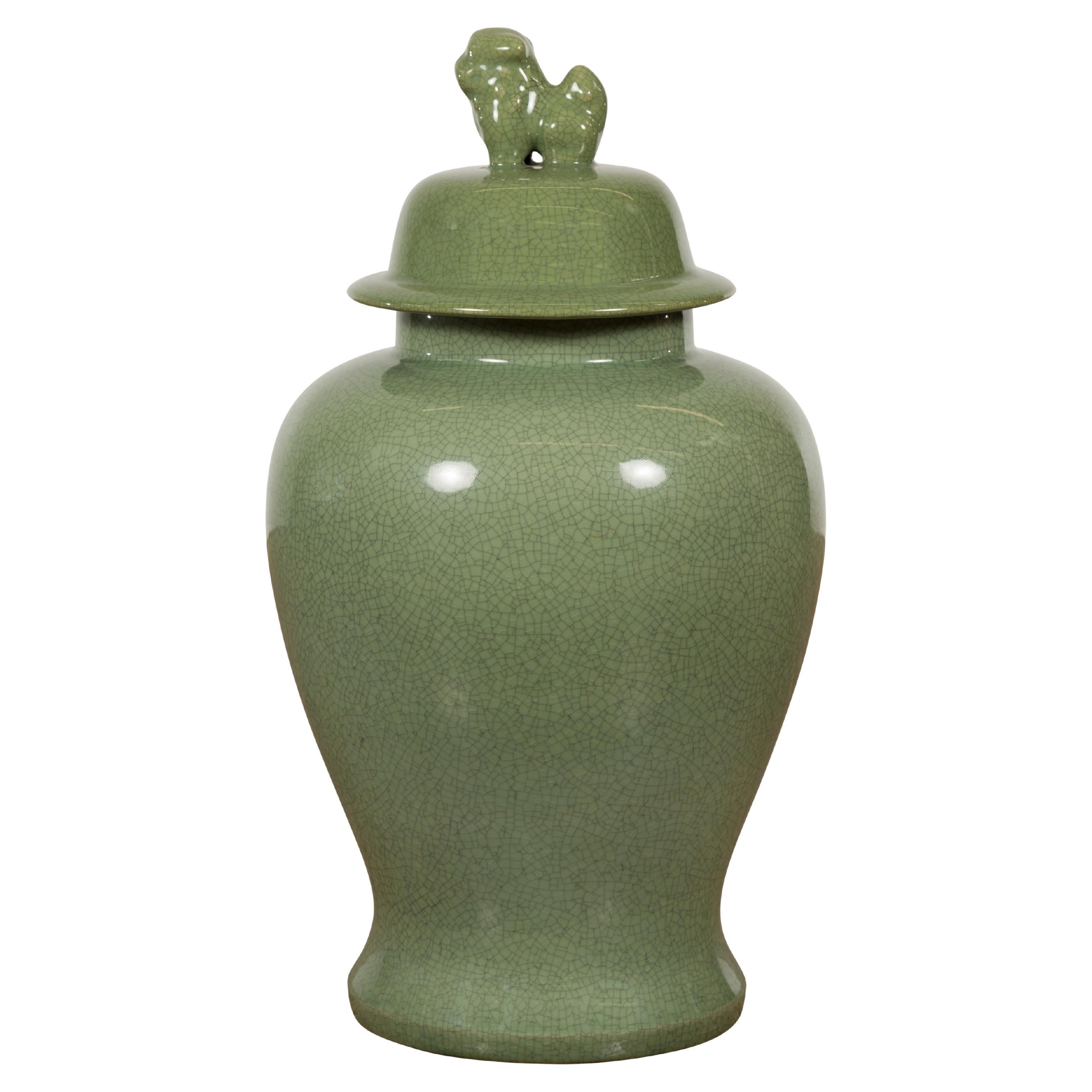 Chinese Lidded Altar Vase with Green Celadon Glaze and Guardian Lion Motif For Sale