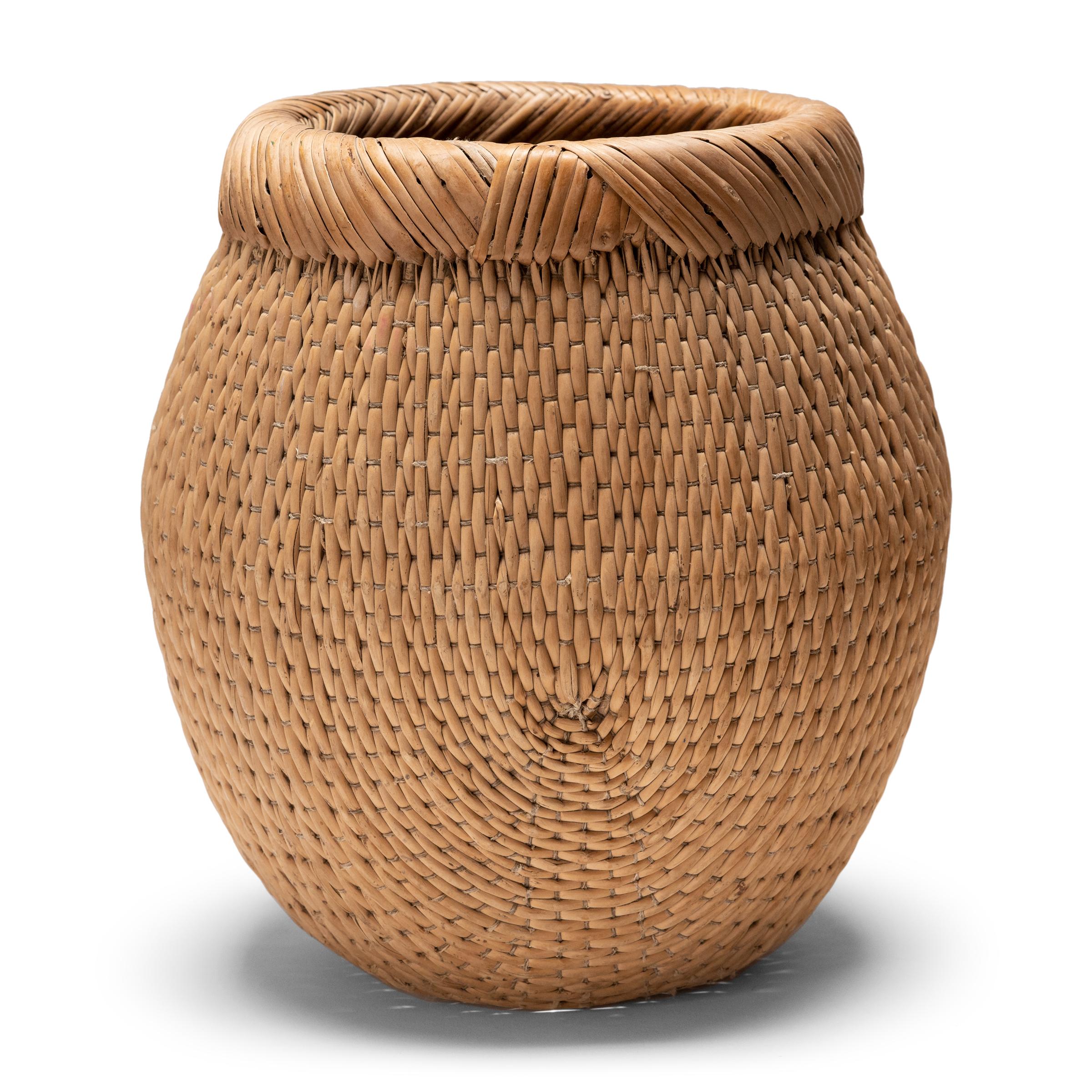 Basket making is an ancient and humble craft, but in the hands of a skilled weaver a simple willow basket can become a truly beautiful work of art. This basket was made in China long ago, and the artisan’s mastery is evident, having been passed down
