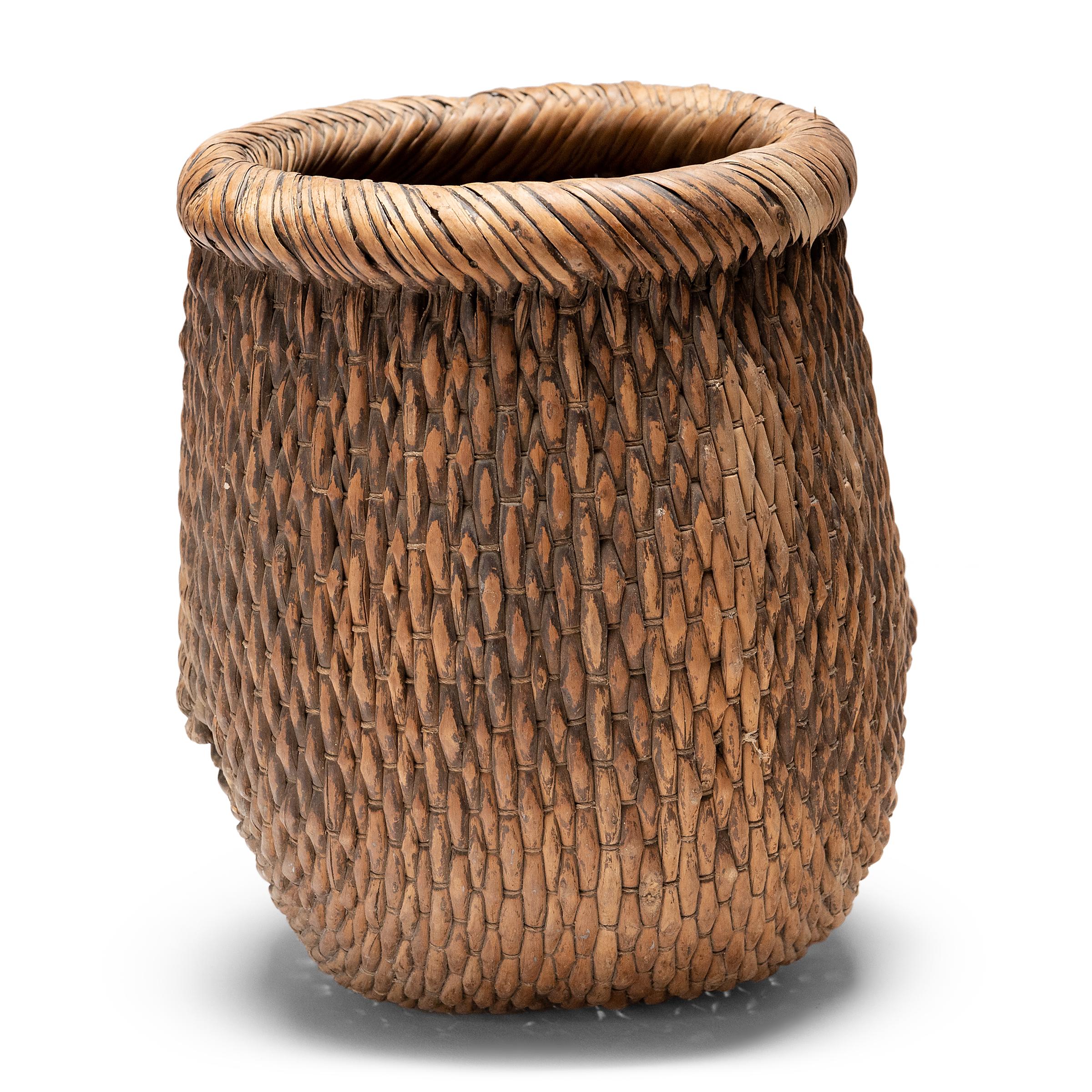 Basket making is an ancient and humble craft, but in the hands of a skilled weaver a simple willow basket can become a truly beautiful work of art. This basket was made in China long ago, and the artisan’s mastery is evident, having been passed down