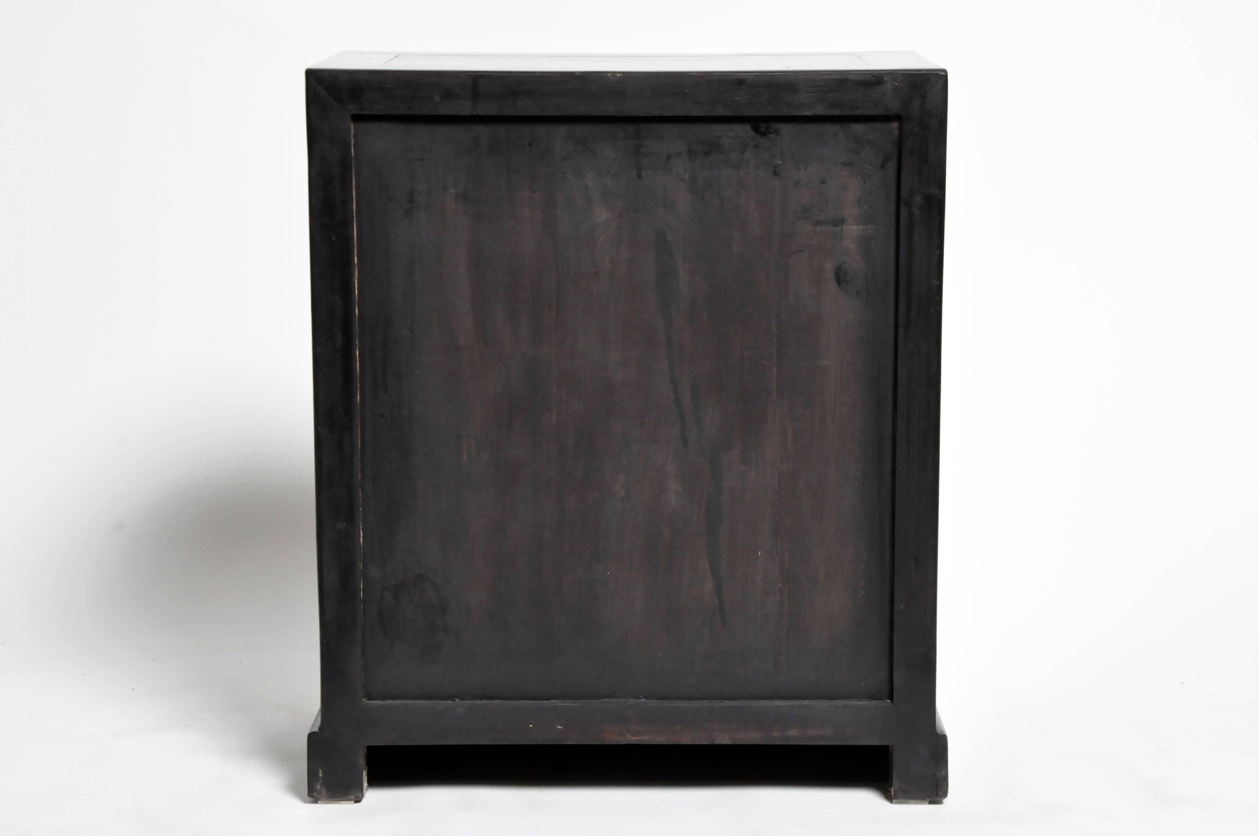 This personal medicine chest is from Zhejiang, China and is made from reclaimed cypress wood. The piece features mortise and tenon joinery and eleven drawers.