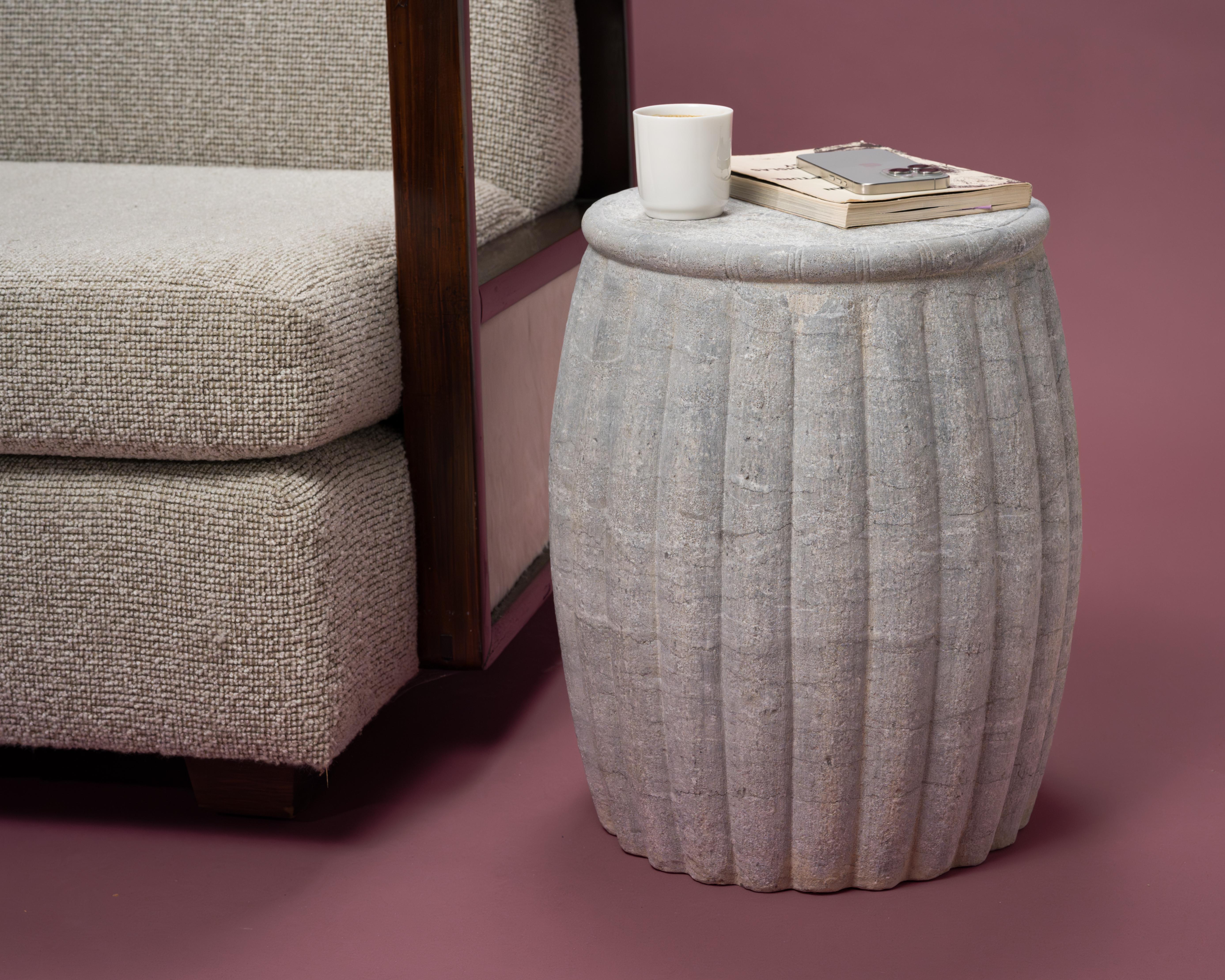 Drum-form stools such as this were traditionally used in gardens and outdoor pavilions where upper class scholars read, wrote, gathered for discussion and, in general, developed their inner sensibilities.

This contemporary example is carved from