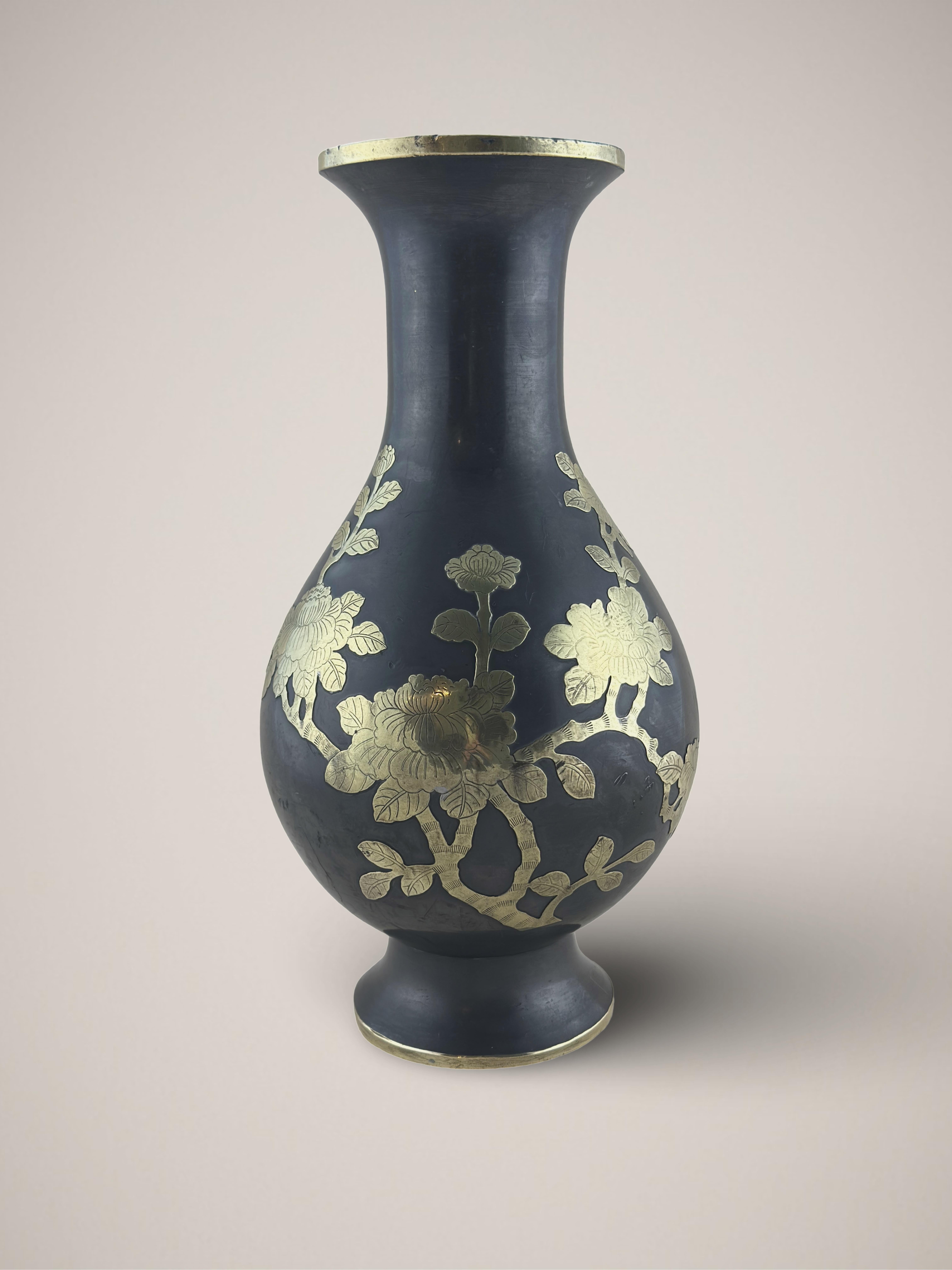 A vintage pewter and brass metal vase. Created during the mid-20th century, around the 1960s, in China.

The vase is adorned with a figural scene of a tree peony in full bloom. Depicted with paper thin brass sheet, meticulously cut and detailed with
