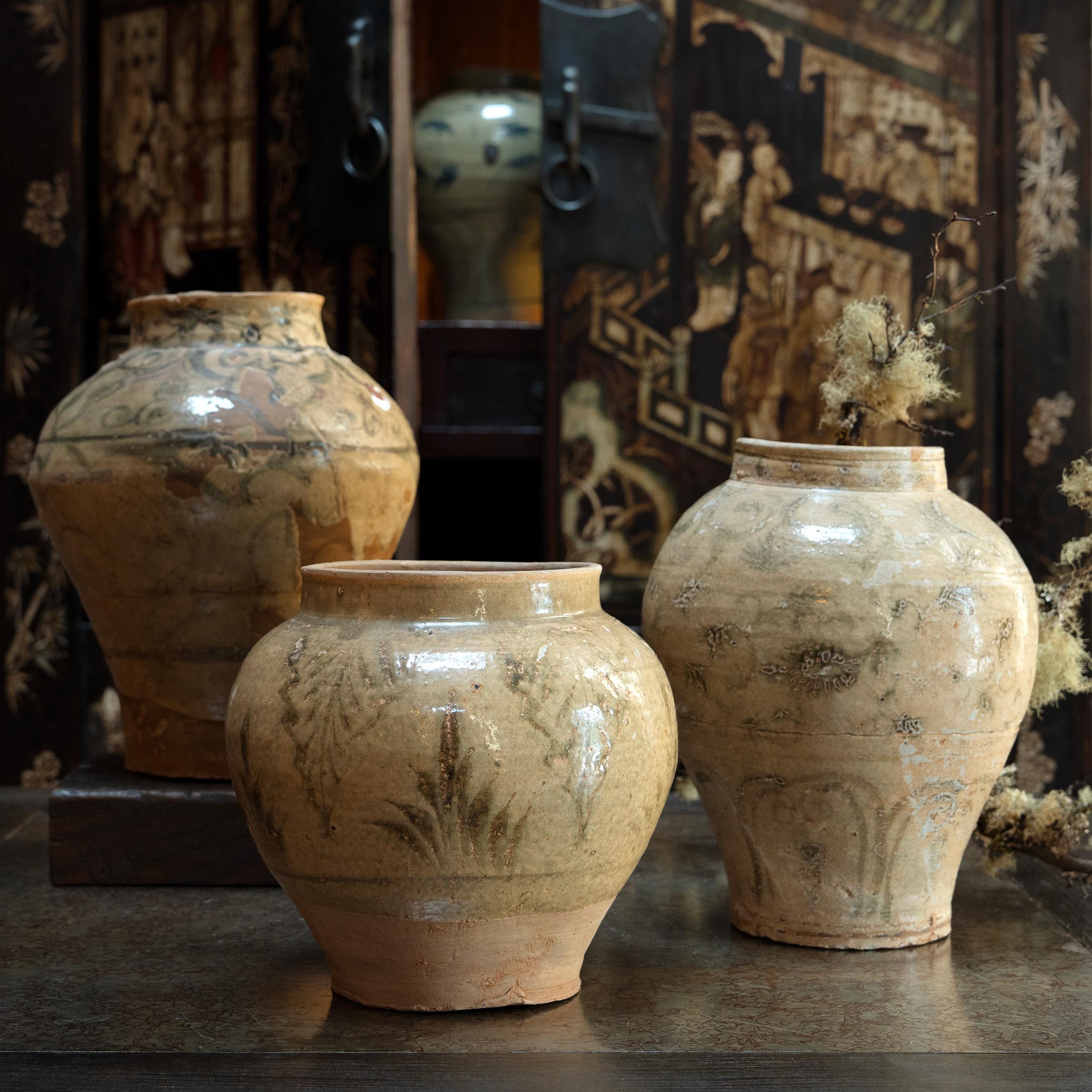 Warped by fire and eroded by time, this ceramic storage jar from Yunnan province is a testament to the wabi-sabi beauty of provincial Chinese pottery. Dated to the 15th/16th century, the wide-mouth jar is an example of the lesser-known blue and