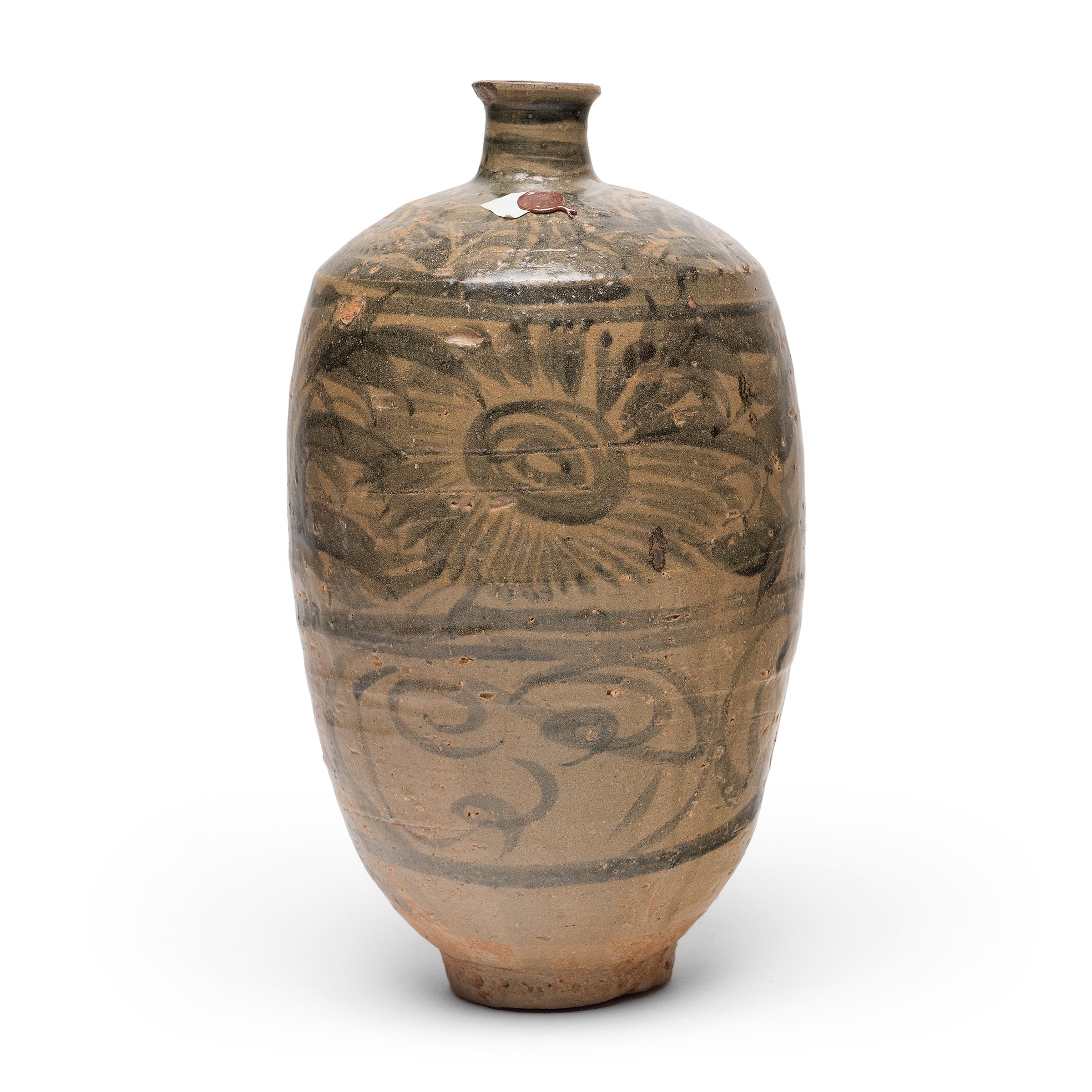 Elegant yet unrefined, this ceramic wine bottle from Yunnan province is a testament to the wabi-sabi beauty of provincial Chinese pottery. Dated to the 15th/16th century, the bottle was originally used to store rice wine or spirits and was likely