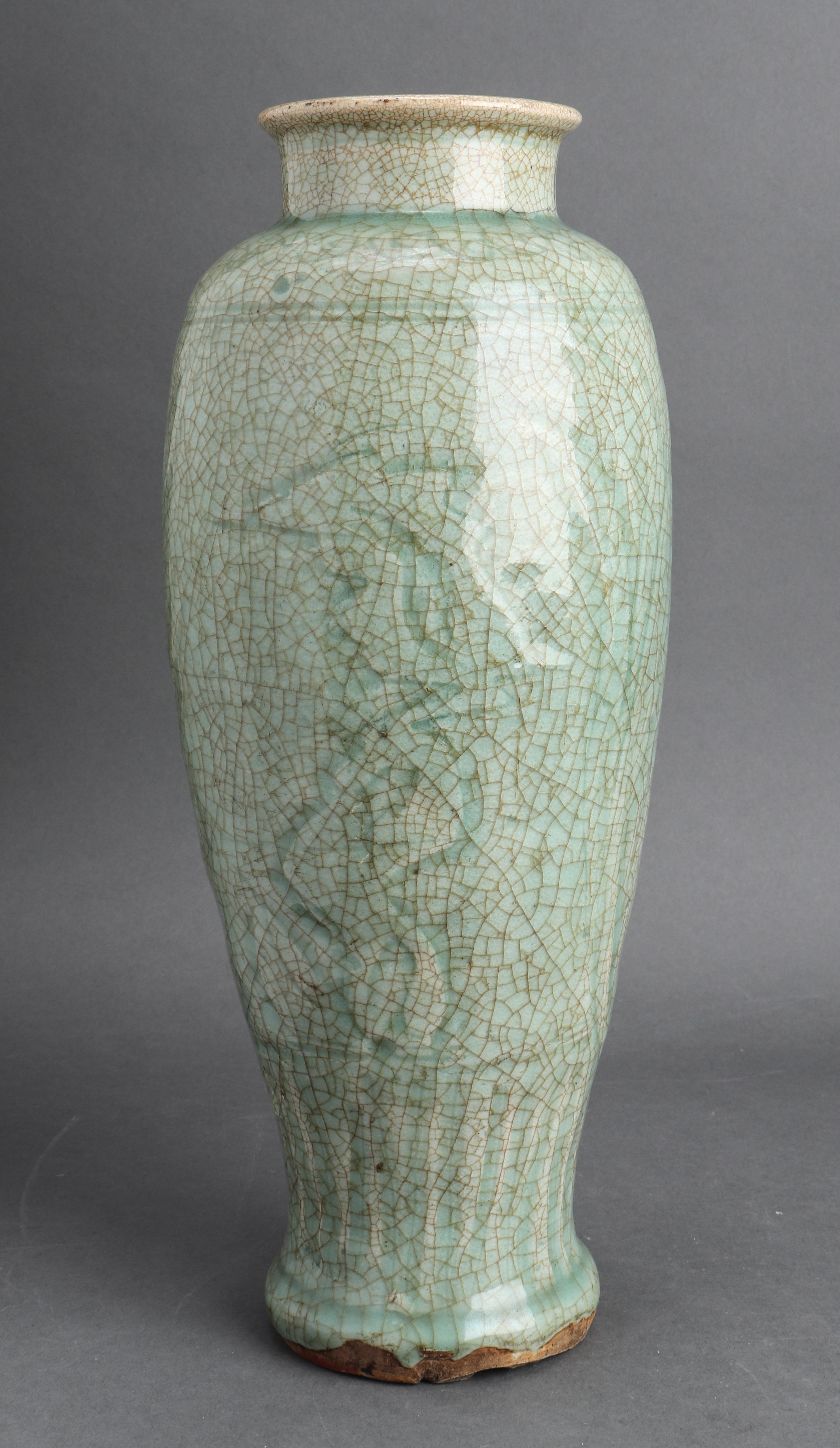 Chinese Ming dynasty (1368-1644) Longquan celadon glazed vase, porcelain with overall crackle glaze, lightly carved and line decoration to underglaze, bottom bears old collection paper label. Measures: 12.75