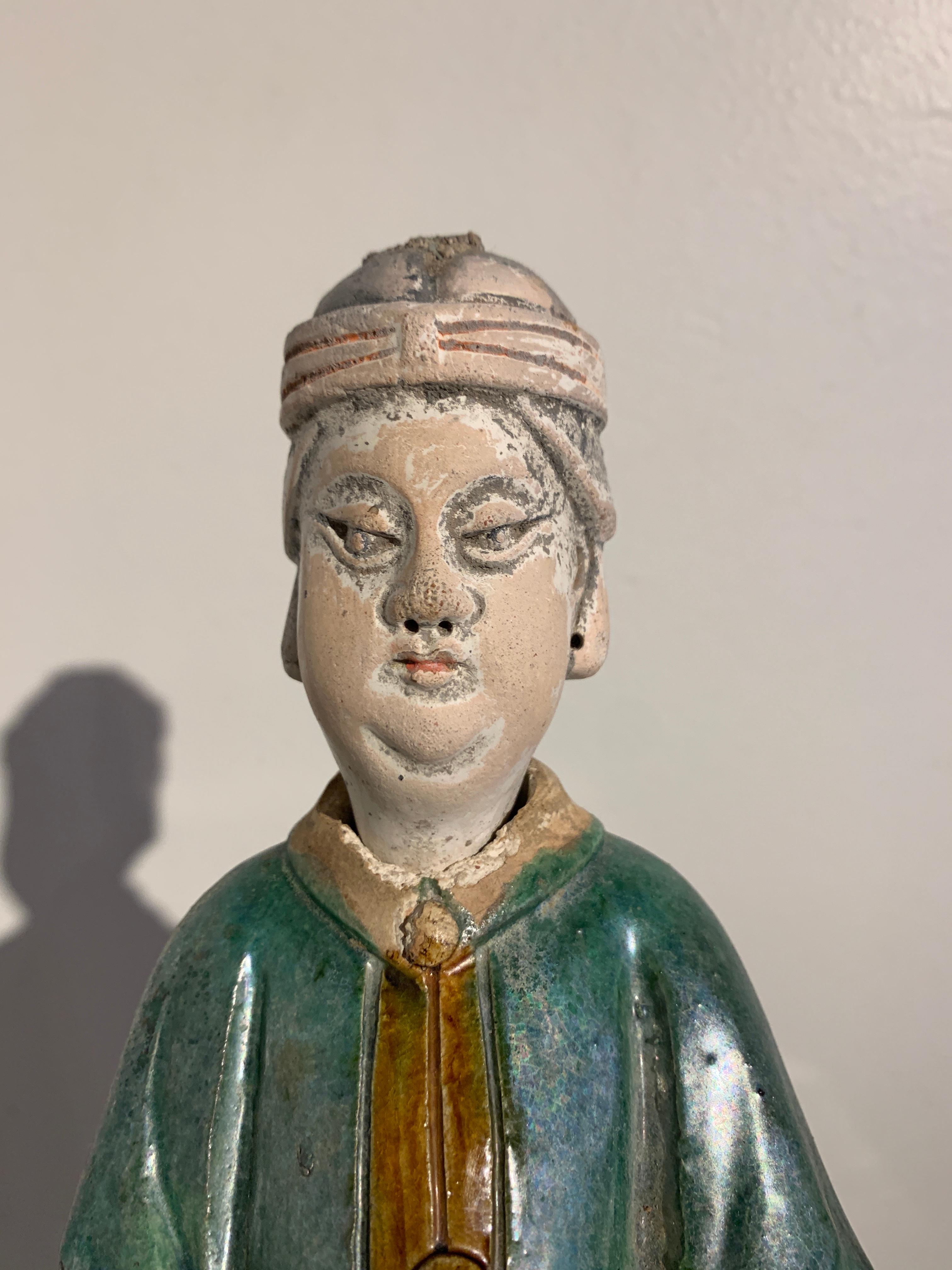 18th Century and Earlier Chinese Ming Dynasty Glazed Tall Attendant Figure, 16th-17th Century, China For Sale