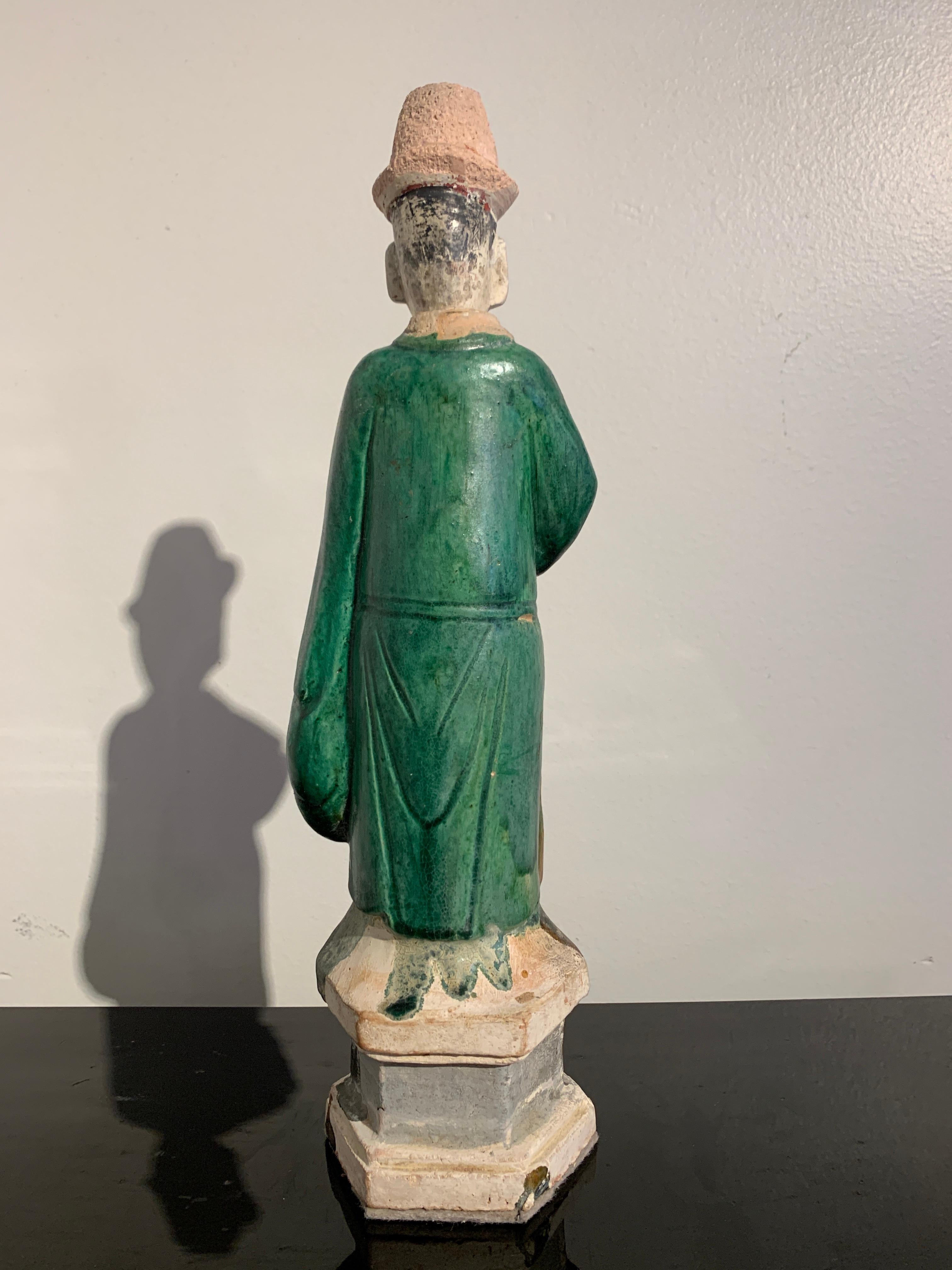Chinese Ming Dynasty Green Glazed Attendant Figure, 16th-17th Century, China In Good Condition In Austin, TX