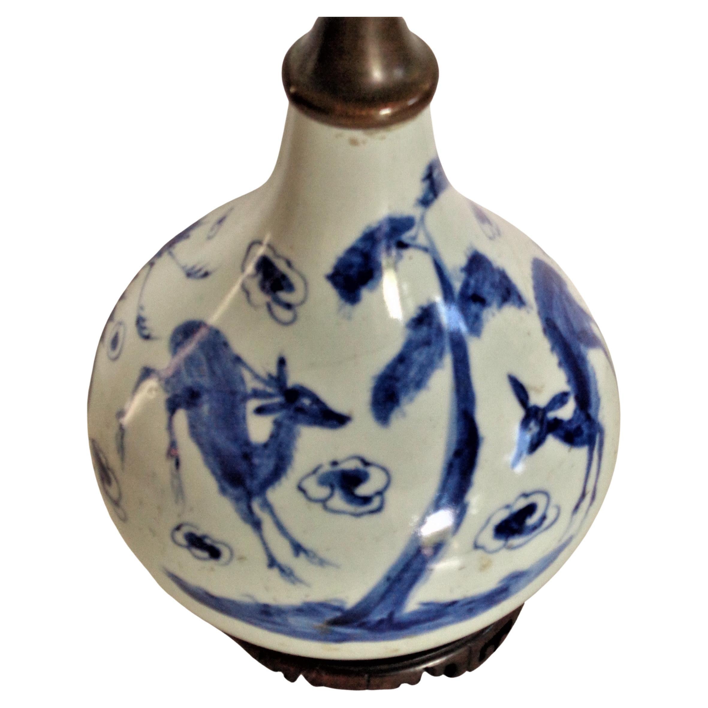 Antique Chinese 17th century Ming Dynasty Kraak porcelain blue and white glazed bottle vase decorated w/ deer, cranes, tree, cloud like symbols. Recessed bottom with blue glazed rim. Top correctly in the round and has not been trimmed - we loosened