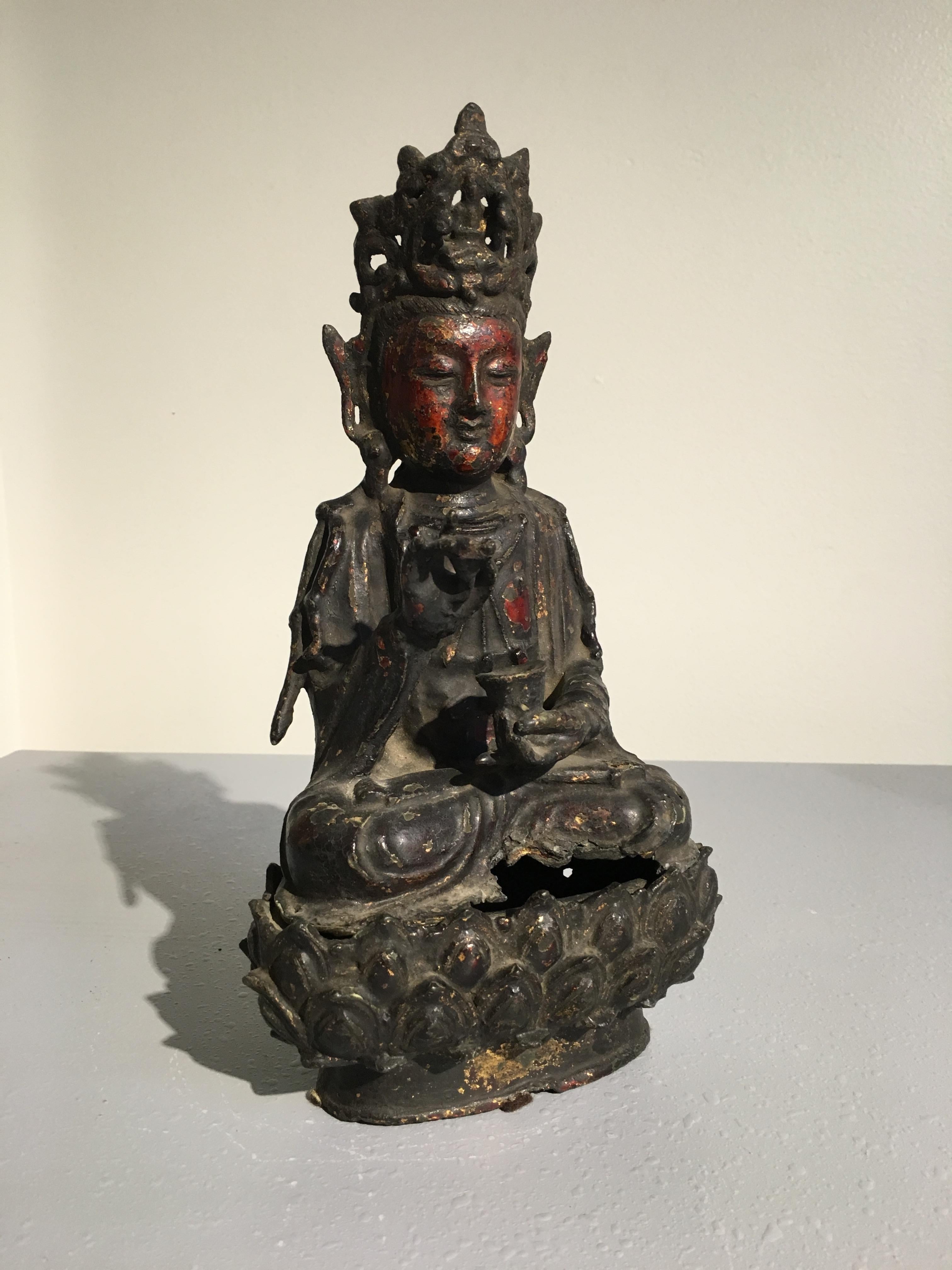 Chinese late Ming dynasty bronze figure of the Bodhisattva Avalokiteshvara, also known as Guanyin (Quan Yin, Kwan Yin, Kuan Yin), 17th century, China 

The figure well cast in two parts, with remnants of rich lacquer and gilding throughout, much