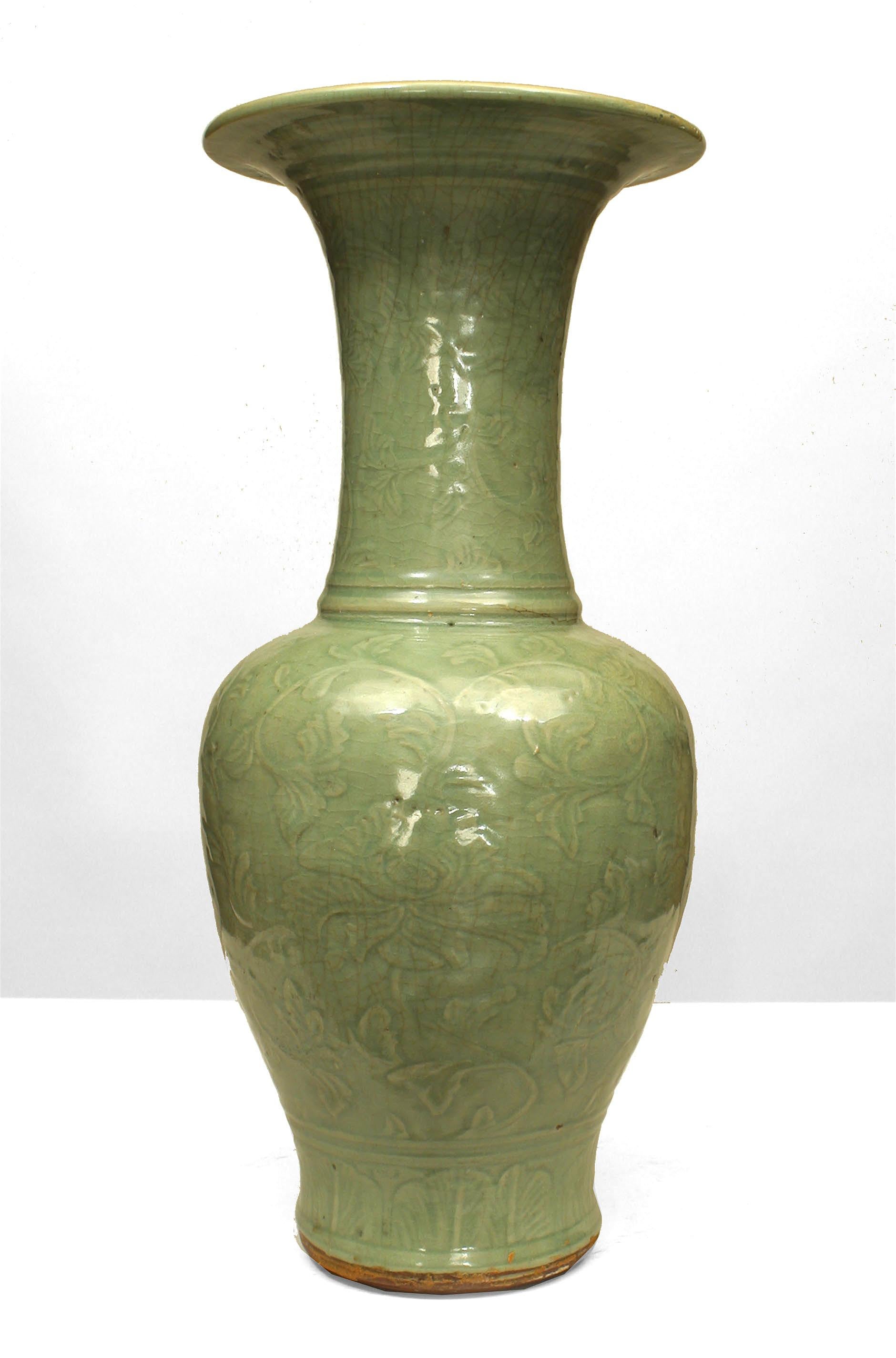 Chinese (Ming Dynasty 15th Cent) celadon stoneware yen yen vase with an overall molded floral relief design in the form of a bulbous base beneath a tapered neck and wide top.