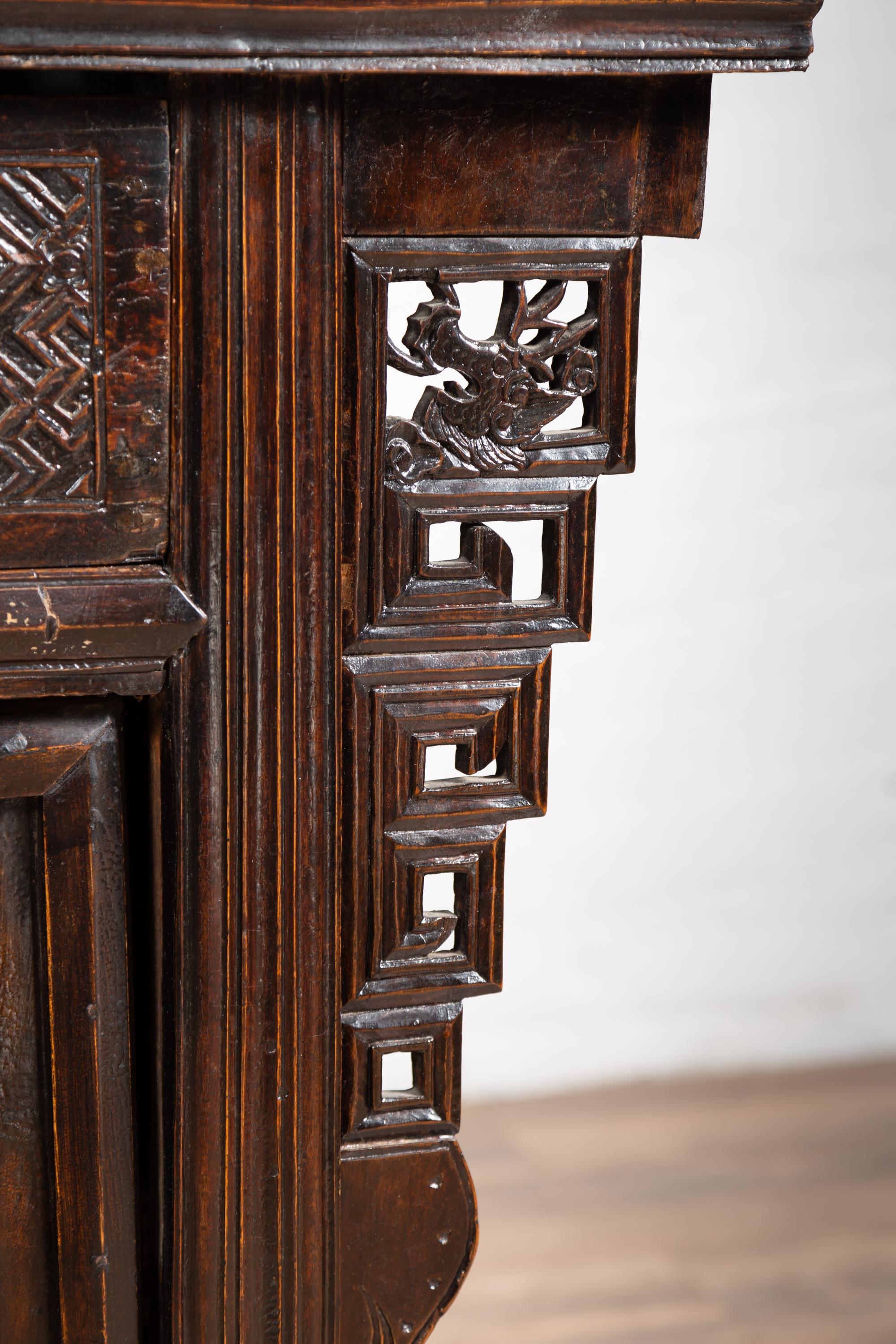 Chinese Ming Dynasty Style Butterfly Cabinet with Carved Spandrels and Doors In Good Condition For Sale In Yonkers, NY