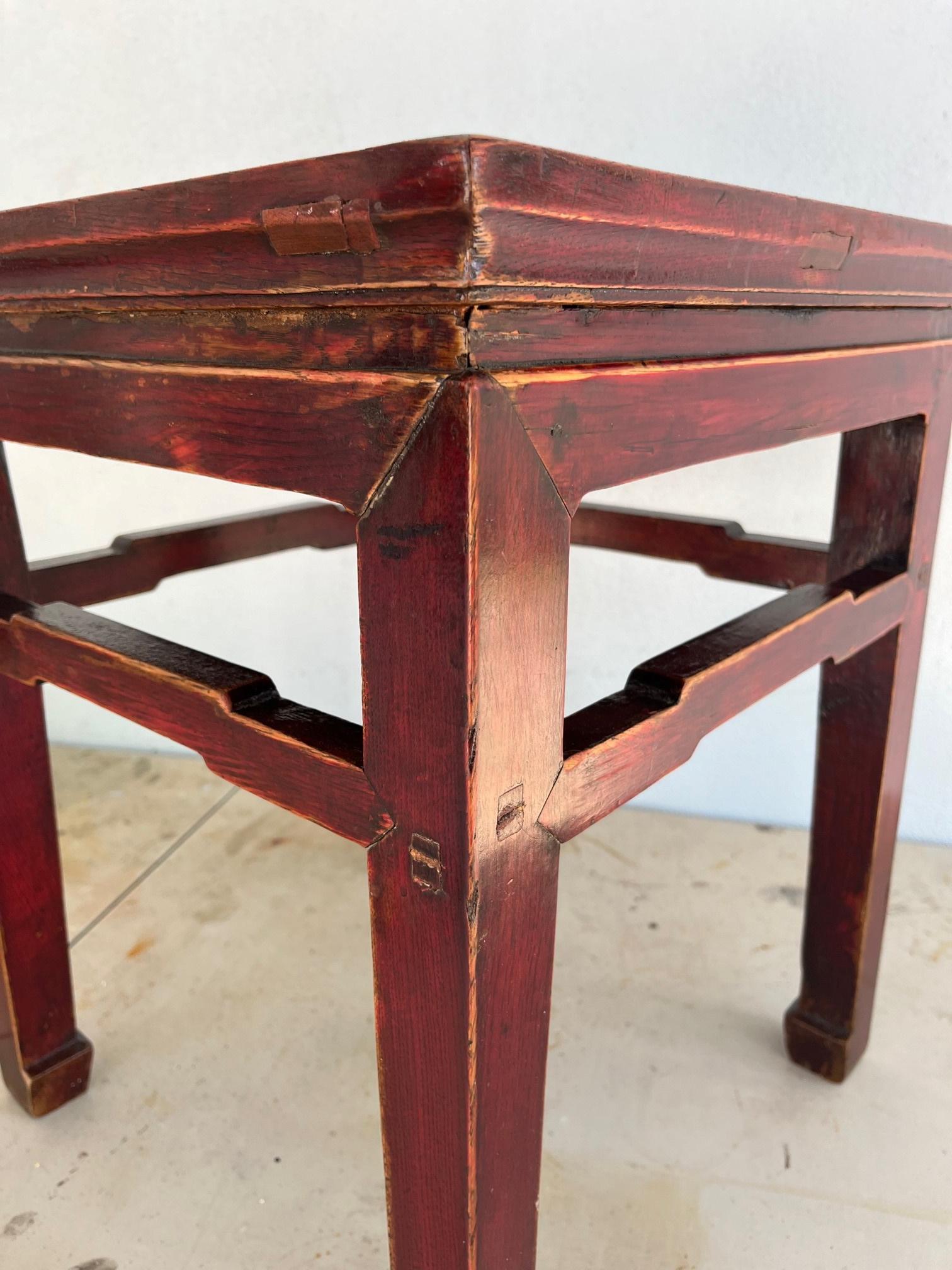 Chinese Ming Dynasty Style side table with humpback stretcher.

Chinese Ming Dynasty style side table from the mid 19th century with
humpback stretchers, horsehoof feet and waisted aprons. It is hand carved
in solid rosewood by fine craftsmen