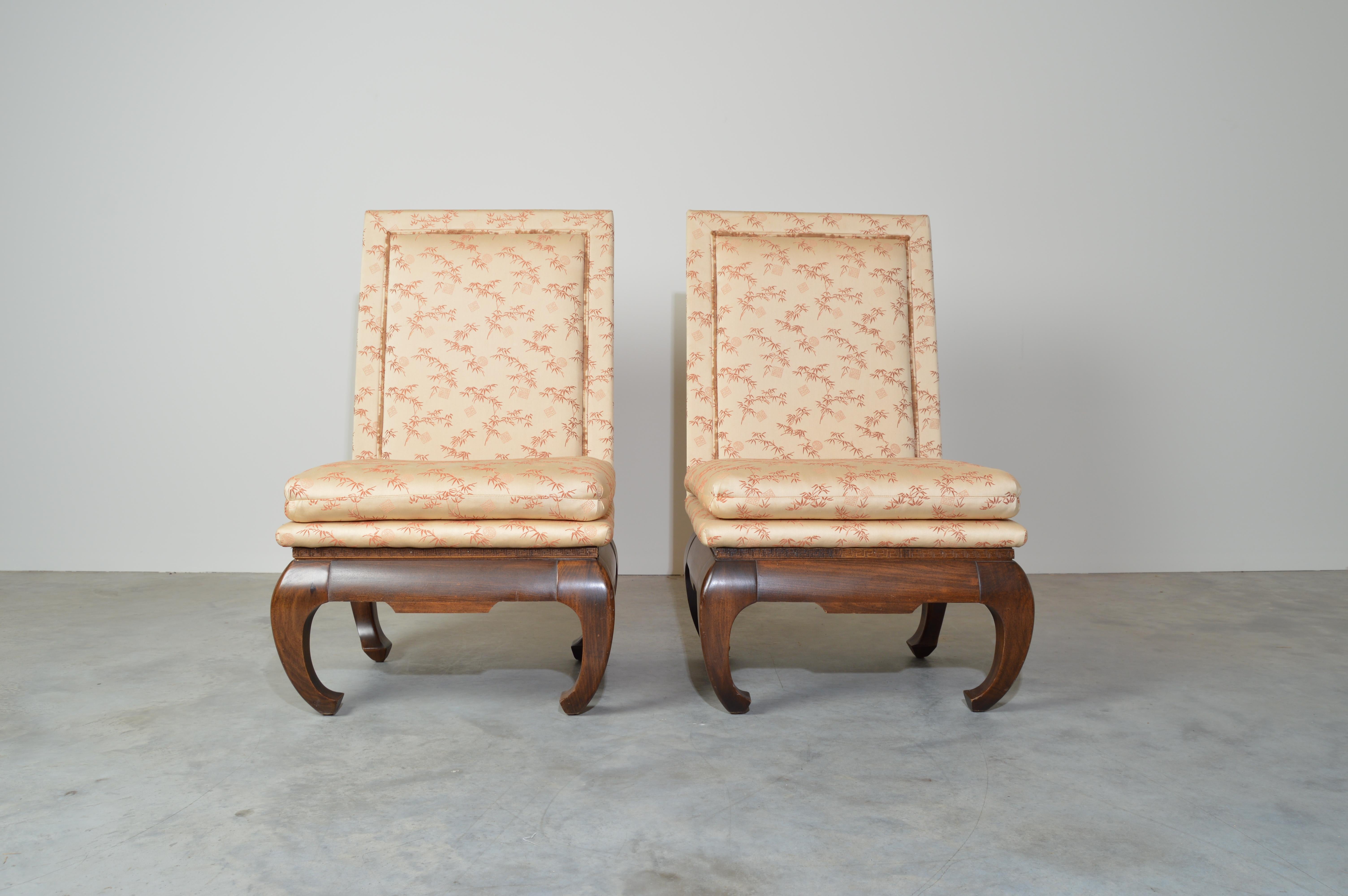 A beautiful pair of Ming Style chairs having sculptural mahogany Chong legs under highback seats with scenic Chinese upholstery. Seat cushions clip at the back so they won’t slide. Very comfortable chairs.
Absolutely stunning.
Solid, clean and