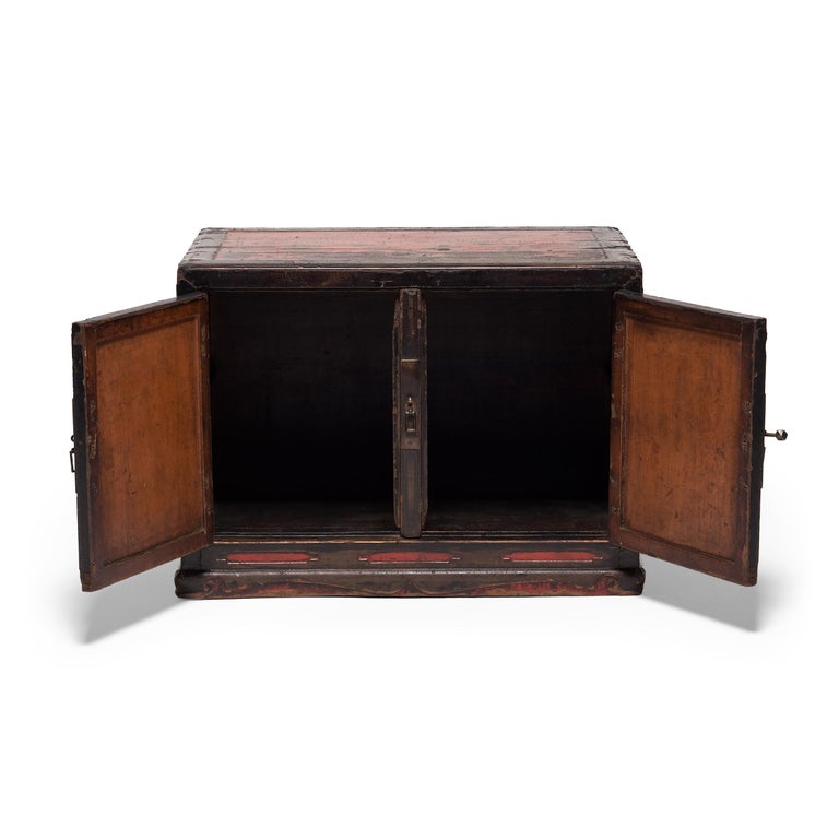 A rolled-up scroll or treasured root pot may have once been among the treasured objects stored in this 19th century book chest. Expertly constructed in China's Shanxi province, the low cabinet exemplifies the clean lines of Ming-dynasty forms. Layer