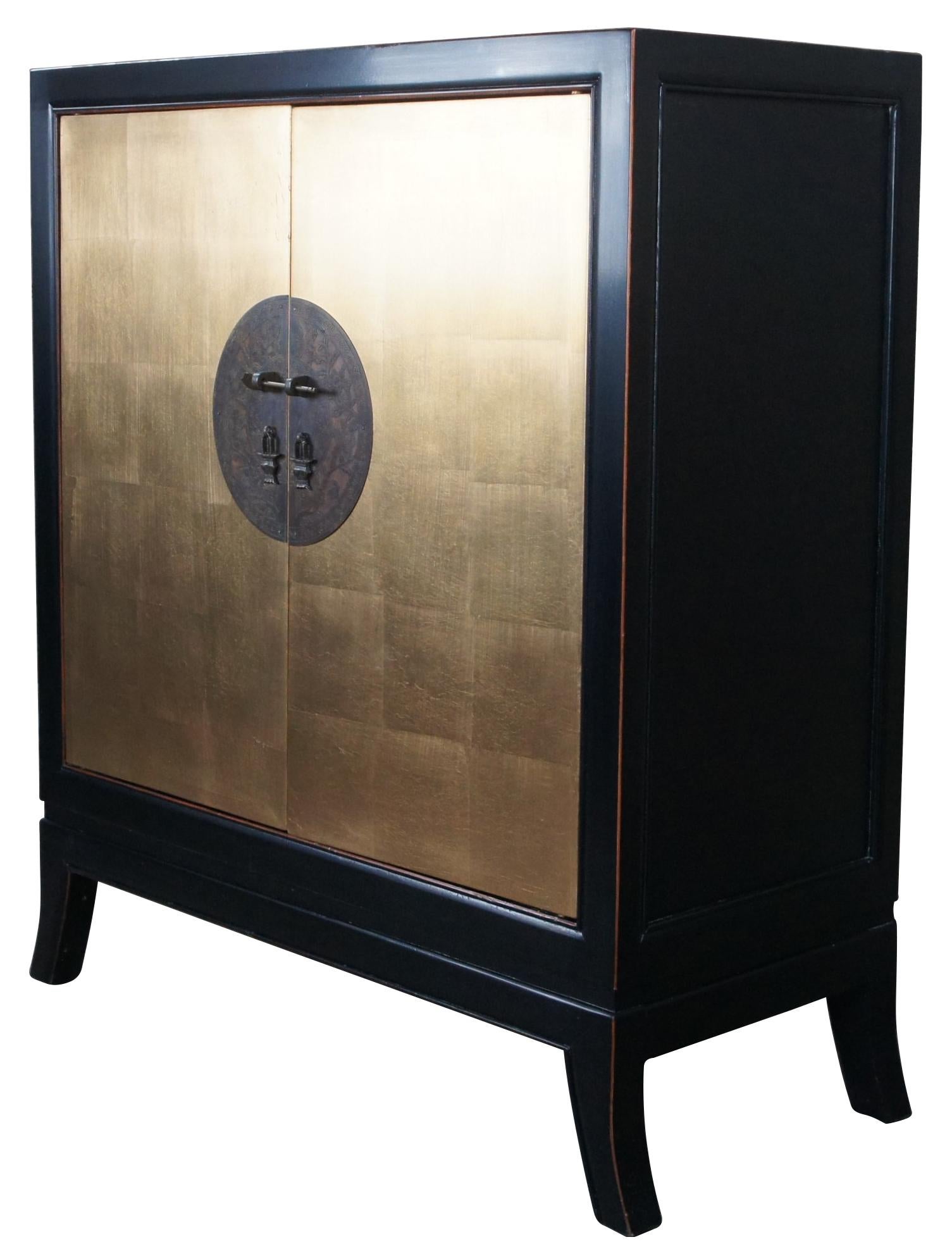 Ming (1368-1644) furniture style is characterized by its simple, clean, and pleasing lines. This reproduction Elmwood Ming cabinet is a fine example of the spare, elegant design. Handcrafted by master artisans in China with hand made gold leaf