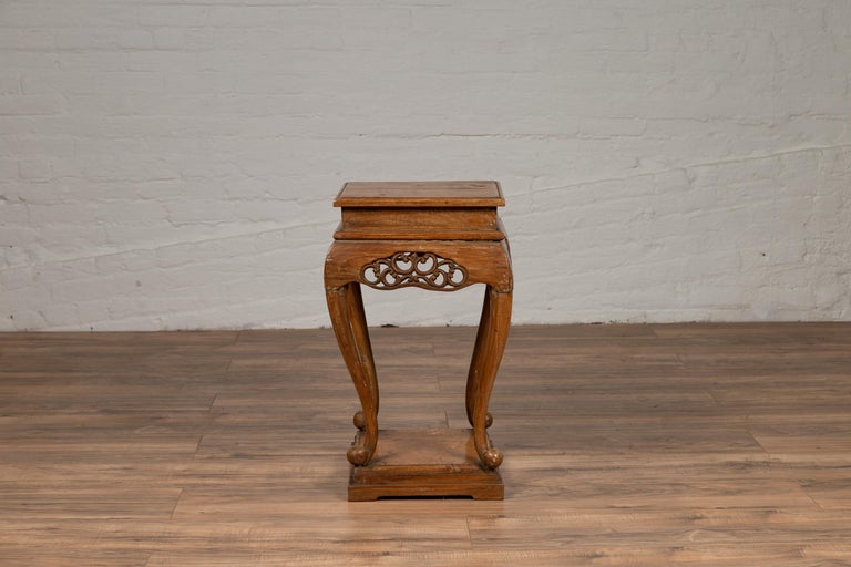 An antique Chinese Ming dynasty style square wooden waisted incense atand from the 19th century, with carved apron, cabriole legs and floor stretcher. Born in China during the 19th century, this exquisite pedestal served as an incense stand.