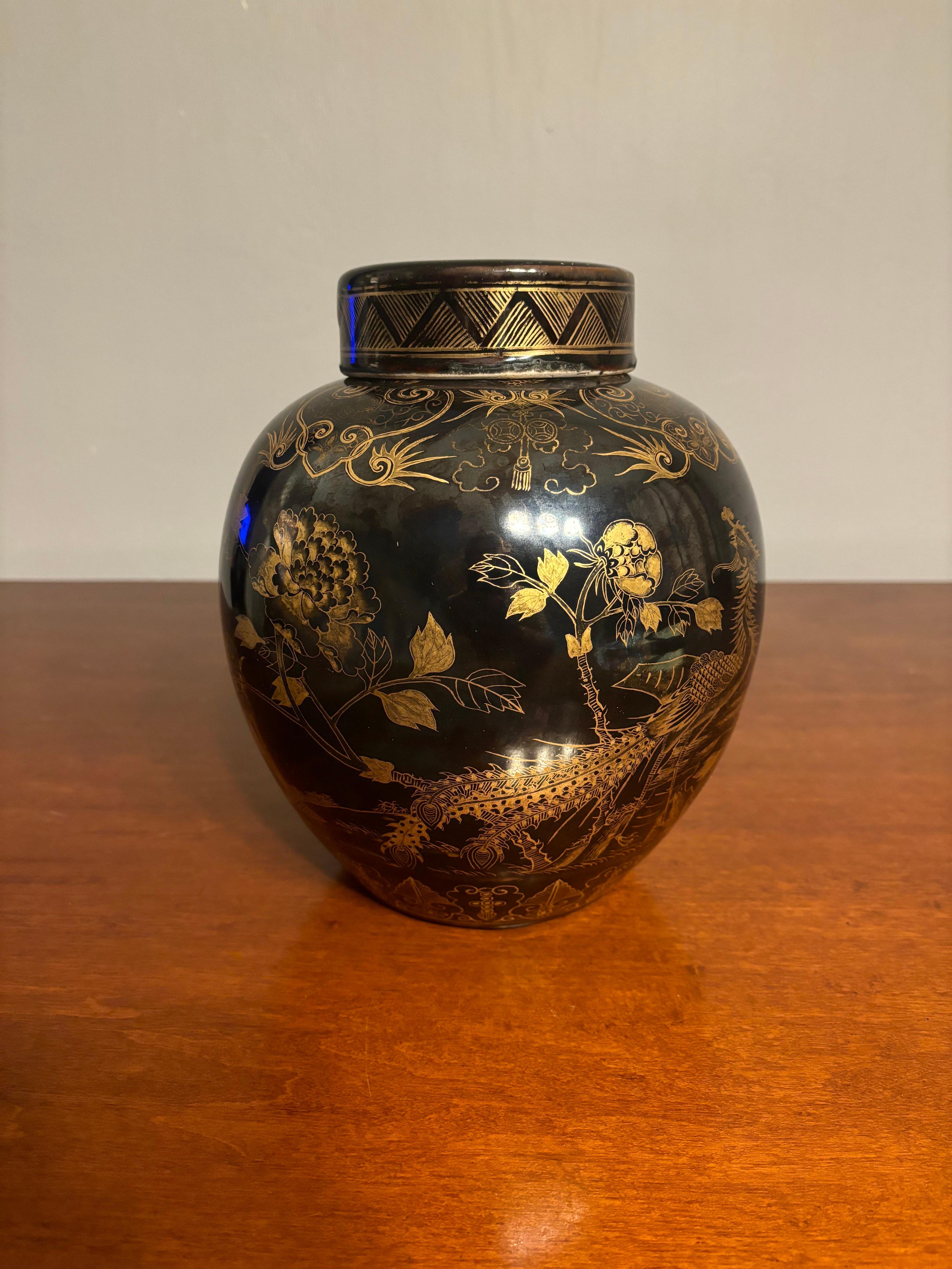 Large antique late 19th century/early 20th century Chinese porcelain mirror black jar with lid. The finish is beautiful and has depth when you look at it. Hand gilt painted pheasant and floral decorations. 

No chips or cracks. Some fading to the