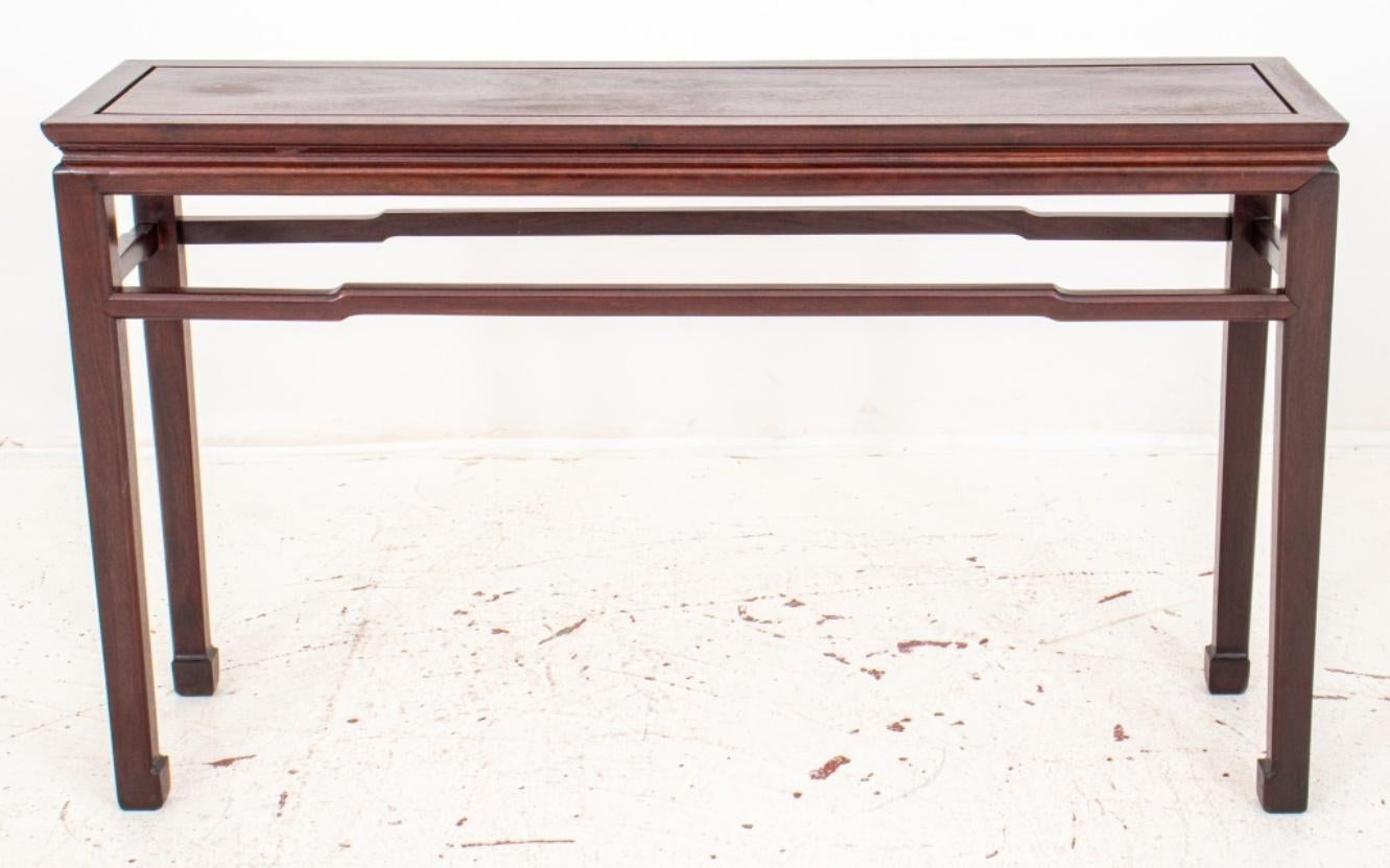 Chinese Modern mahogany console table raised on carved tapered legs joined by stretchers.

In good condition. Wear consistent with age and use.

Dimensions: 32