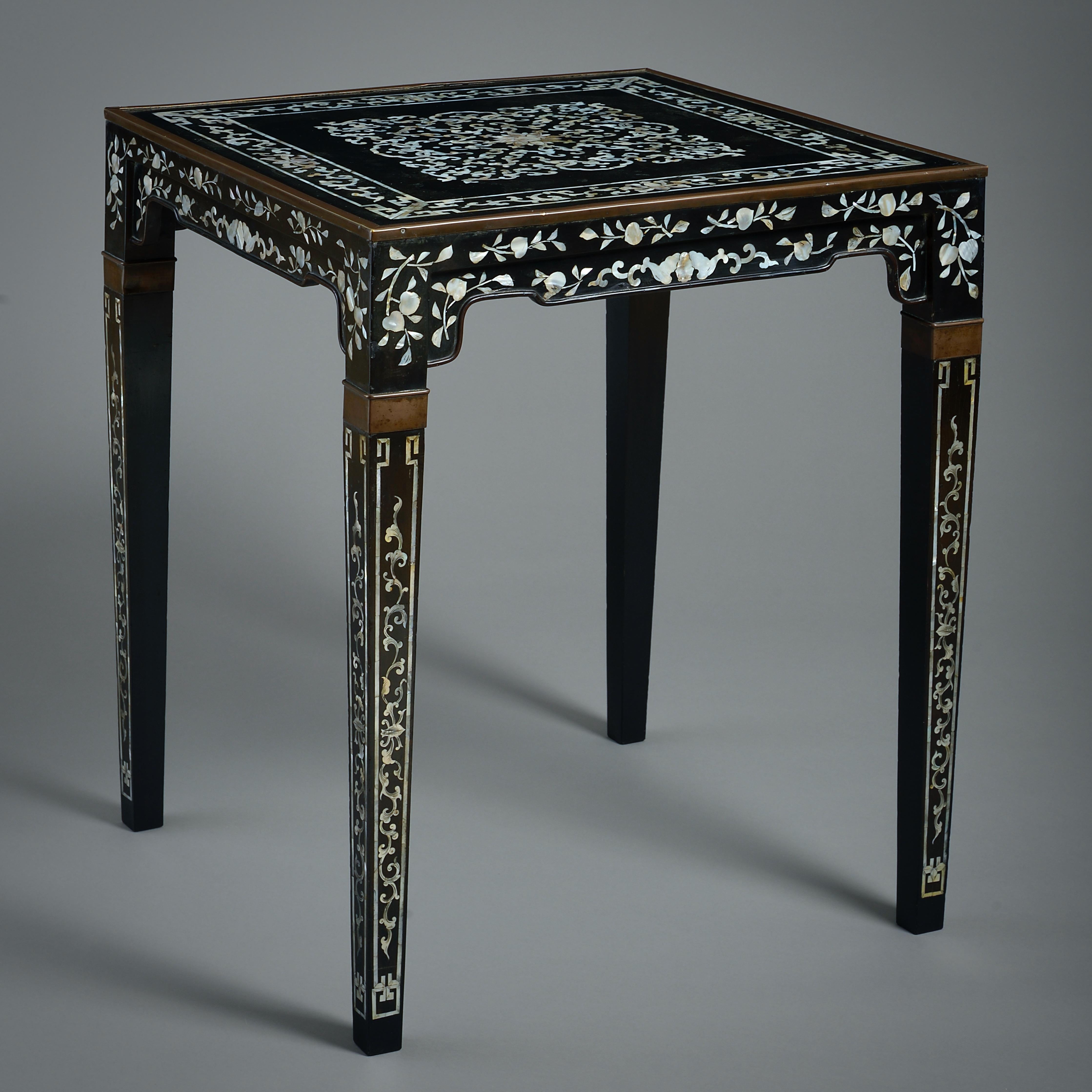 A CHINESE MOTHER-OF-PEARL AND BLACK LACQUER TABLE, 19TH CENTURY.

Inlaid throughout with intersecting scrolls, the square top with a brass edge on square tapering legs.
