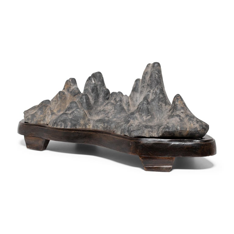 Known as gongshi, or scholars' rocks, lingbi stones such as this were fixtures of the scholars' studio, displayed as sources of beauty and creative inspiration. Meditating on the stone’s intriguing, suggestive form, the scholar found inspiration in