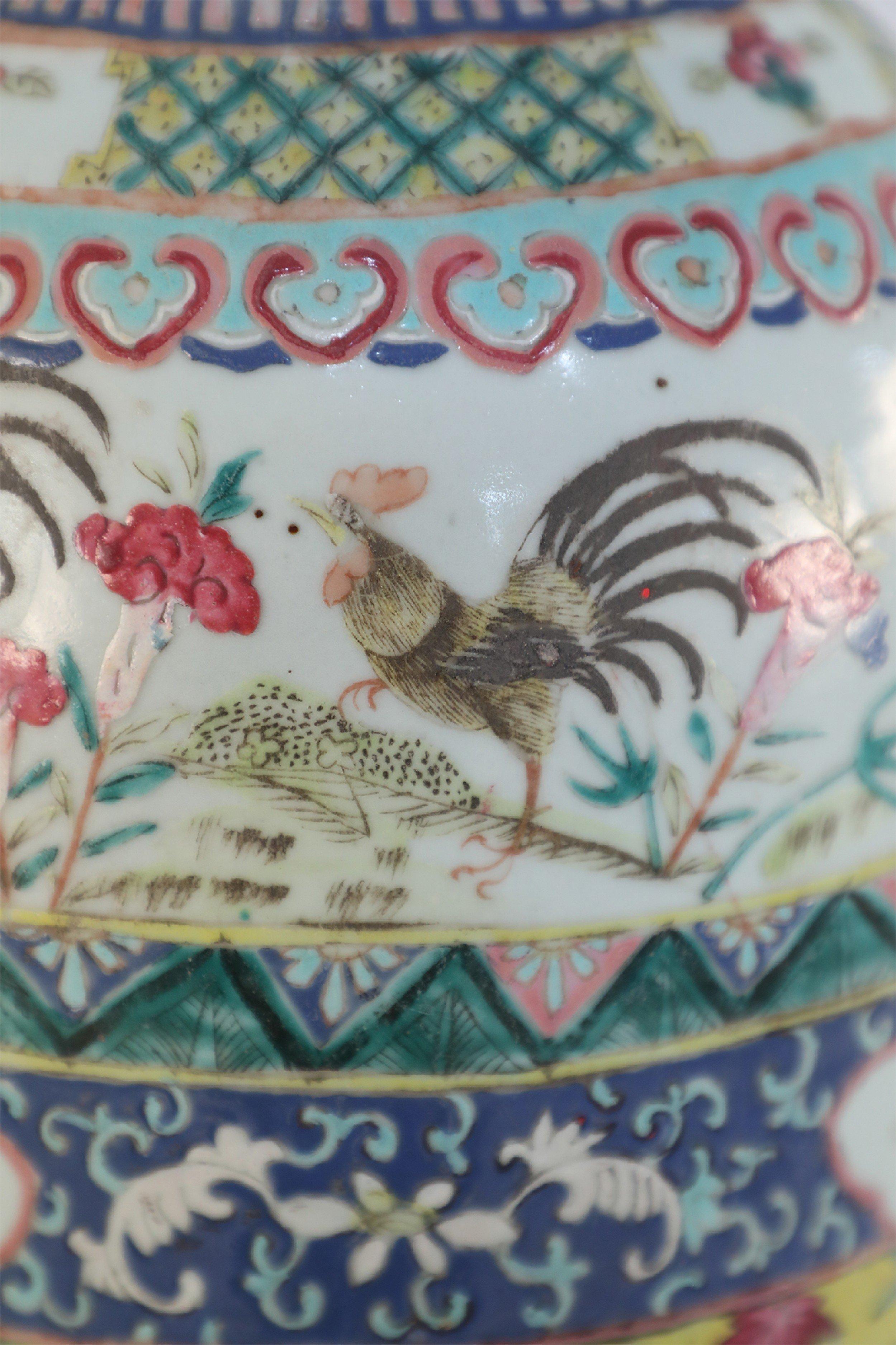 Antique Chinese (Late 19th Century) porcelain urn wrapped in a variety of patterned bands, including florals, roosters, and geometric patterns in pink, green, blues and yellows.
 