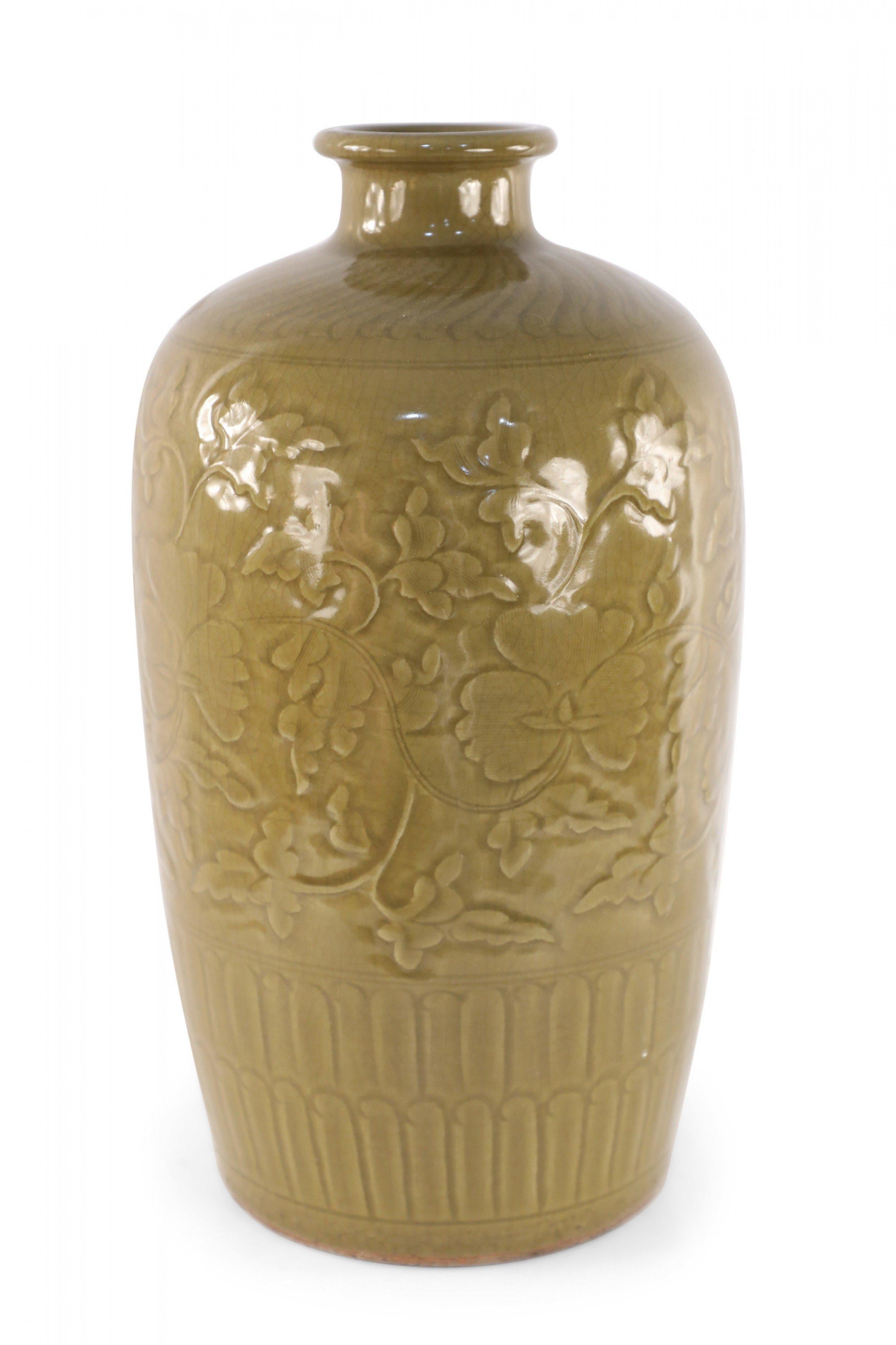 Chinese, mustard-colored porcelain Meiping form vase carved in raised, tonal florals, with patterned bands around the top and base.