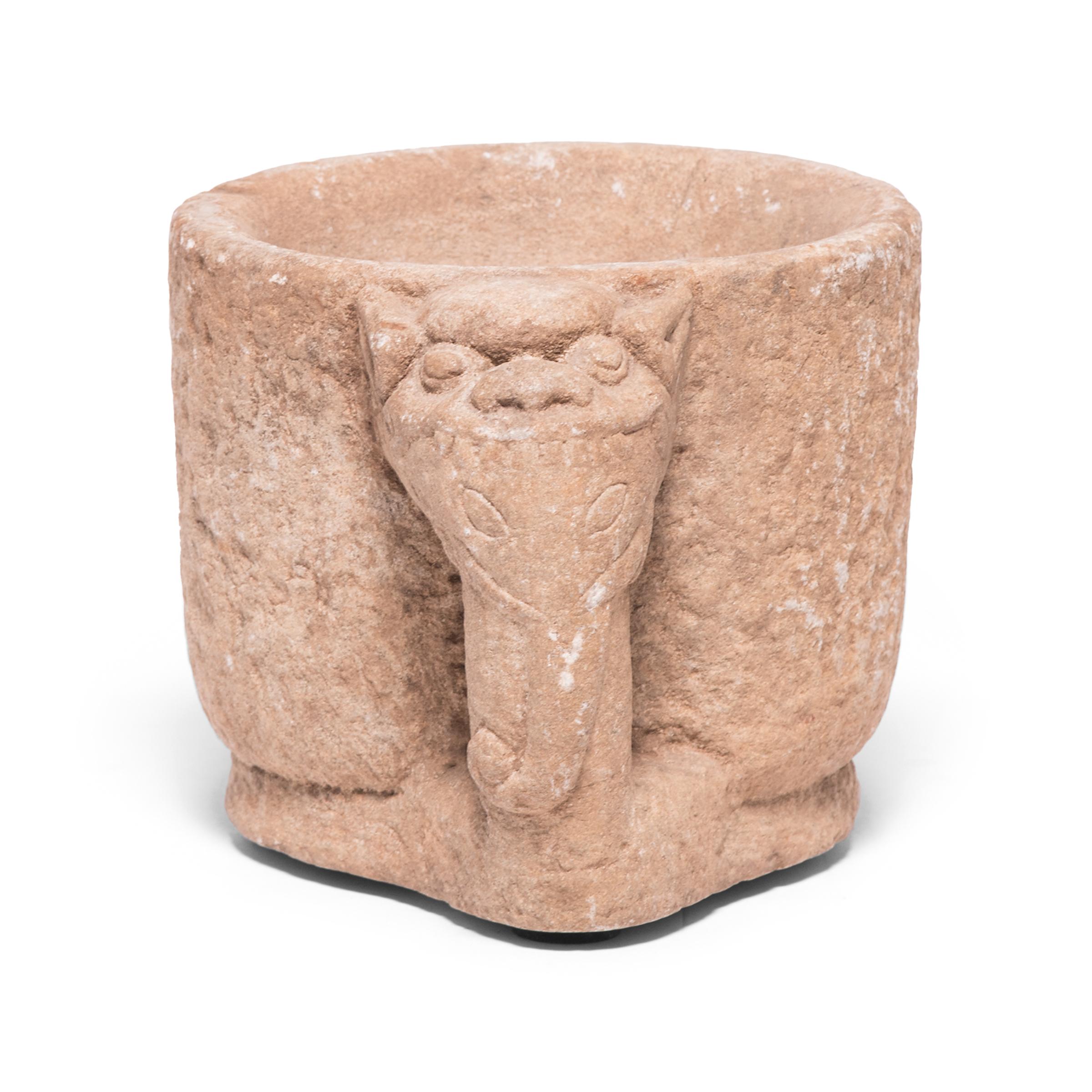 Hand carved from a single block of limestone, this 19th-century sculptural container was originally used as a mortar, possibly in a Chinese apothecary to grind herbal medicines. With a clean, rounded form, the mortar is devoid of decoration, save