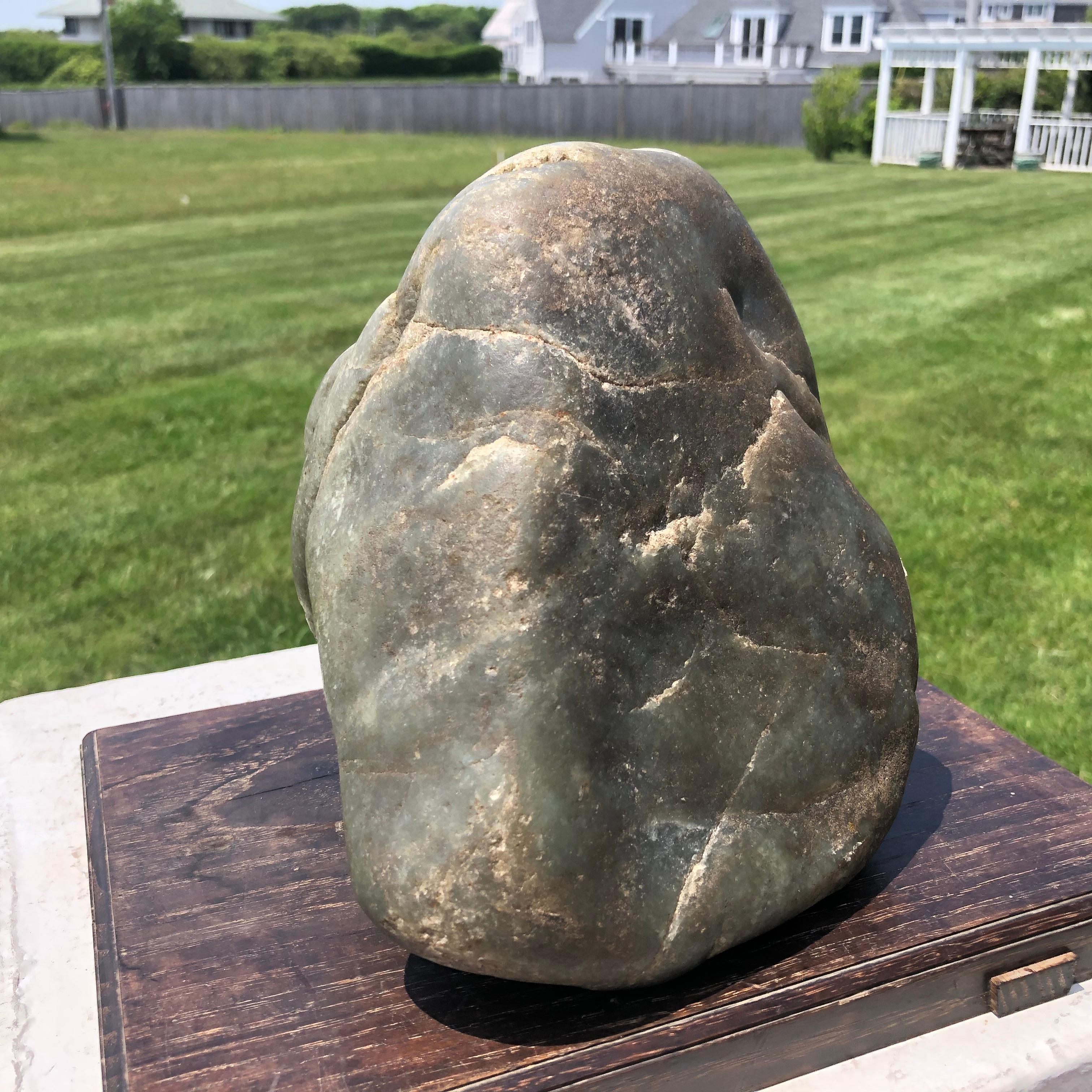 A fine large natural  Hetien jade  scholar rock in boulder form collected from the Khotan region of western China in 1995.

Weighs in at 14.1 pounds.

Beautiful color and quality.

A complimentary black hardwood display base is