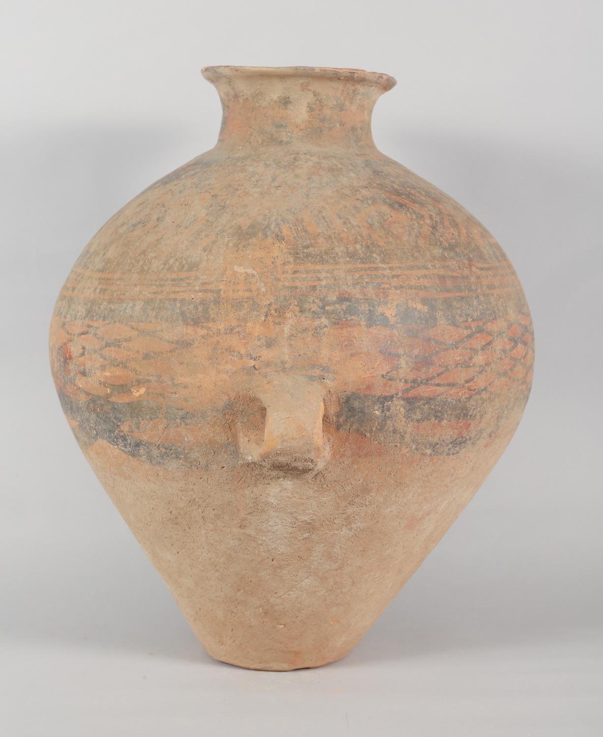 Chinese Neolithic Ovoid Pottery Jar from the Majiayao Culture, specifically the Machang phase, in northwest China, and dating back roughly 4000 years. Jar is made from earthenware and painted geometric motif. Jar has a ovoid-shaped body, that tapers