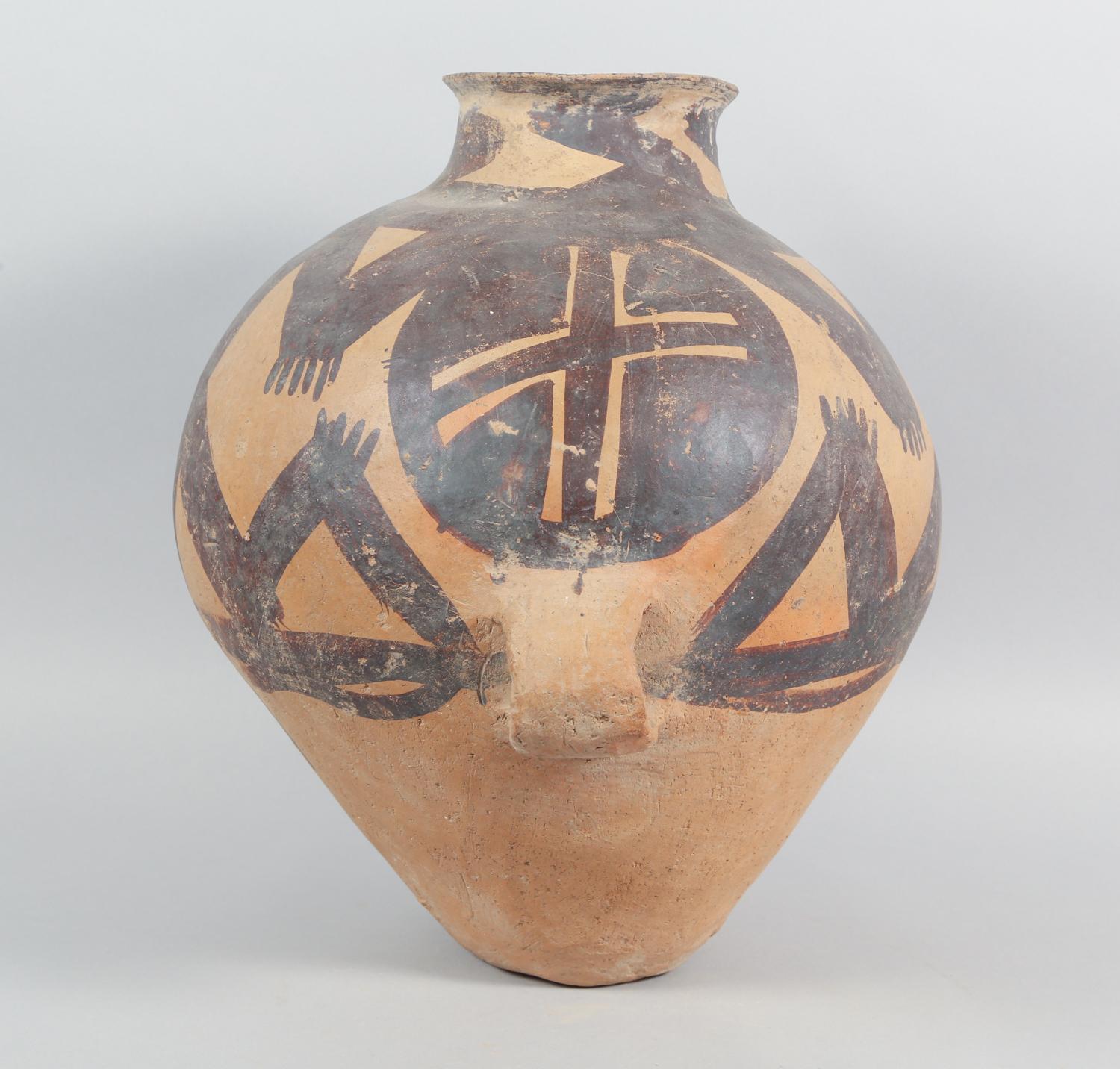 Chinese Neolithic Pottery Jar from the Majiayao Culture, specificaly the Machang phase, in northwest China, and dating back roughly 4000 years. Jar is made from earthenware and painted with geometric motif. Jar has a pear-shaped body, featuring a