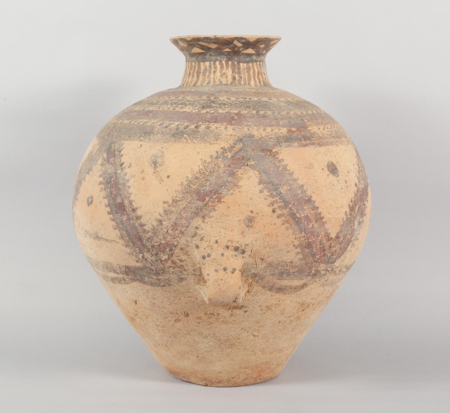 Chinese Neolithic Pottery Jar from the Majiayao Culture, specifically the Machang phase, in northwest China, and dating back roughly 4000 years. Jar is made from earthenware and painted with reddish-brown geometric motif. Jar has a pear-shaped body,